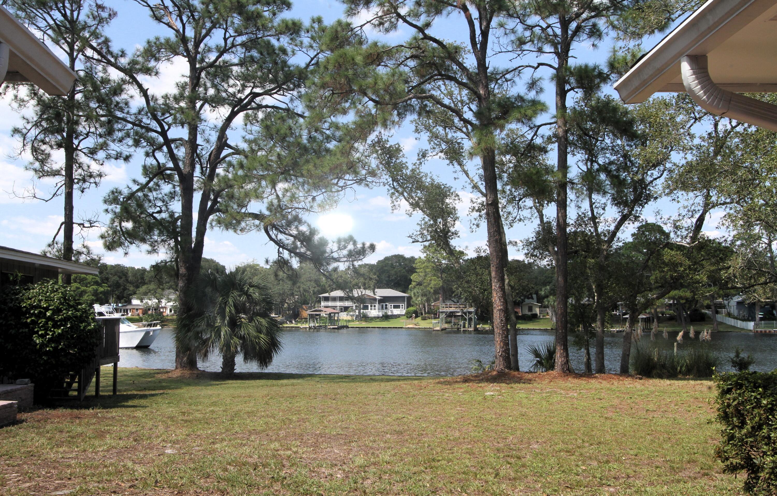 Discover your waterfront haven on the shores of Lake Earl, sheltered with direct access to Choctawhatchee Bay! With a large lot, NO HOA, and two homes, this unique property has endless possibilities as the hard work has been done for you- just update with your style. Whether you envision it as your dream home with an income-producing space, a welcoming retreat for guests, or a serene escape for yourself, the choice is yours. Water enthusiasts will find their paradise right in the backyard! Main Home-2180 sq ft. Cottage-884 sq ft.Roof on both homes& garage 2017. Main home: HVAC 2022, water heater 2018, full house generator 2022. Cottage-complete rewire 2018, HVAC and water heater 2014. Please see docs for additional information .