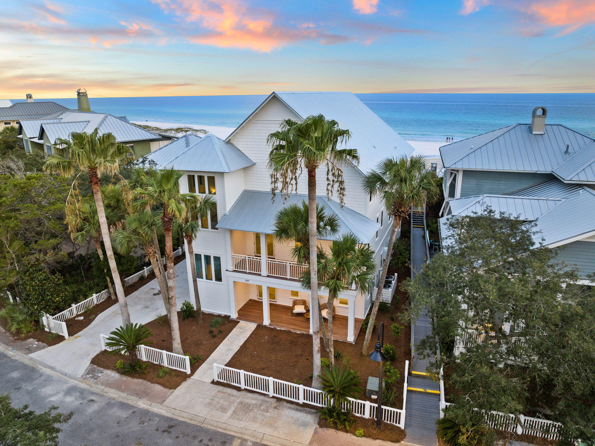 PRICE IMPROVEMENT! Newly built / full renovated gulf front opportunity. Reigning on a homesite atop the dunes of the charismatic community of Old Florida Beach, this charming beachfront home affords unprecedented coastal living. The private gated enclave of residences is prominently situated in Blue Mountain Beach along 30A in Northwest Florida. Curated with the luxury lifestyle in mind, this one-of-a-kind home showcases a coastal design vision brought to life with the highest quality materials and finishes. Overlooking one of the most sought-after beaches in the US, the breath-taking views of the sugar white sands and the emerald green hued waters can be enjoyed throughout all three levels of the home. A well-though-through floor plan paired exquisite design creates an unparalleled experience of seaside living. Positioned adjacent to one of the rare coastal dune lakes of 30A, Draper Lake, residences enjoy both the gulf front and lakeside lifestyle. Fully renovated, the property offers gulf front new construction rarely found at this price position.
The attractive presence is appreciated upon initial approach. The front elevation is moored by a courtyard bordered with lush landscaping. Upon entry, visitors are greeted by the impressive foyer. This level was thoughtfully configured for privacy of all guests. A secondary primary suite, large guest suite, secondary guest suite and bunk suite are all found on this level. A large mudroom with double stacked laundry and additional storage completes the first floor.

The striking stairwell provides ample natural light which highlights the natural white-oak flooring while granting access to the main level of the estate. The chef's kitchen anchors the great room. Marble countertops, luxury gas range, built-in refrigeration, farm-house sink, sprawling island, breakfast area and a spacious dining space complete the kitchen. The living space is highlighted by a soaring vaulted wood ceiling, tons of windows and a large slider granting access to the outdoor living. Located outside is a well-equipped outdoor kitchen and private pool. The primary suite is located off the great room and offers one-level living for the future owners of the property. The well-appointed primary bathroom features a free-standing soaking tub and spacious walk-in shower. A roomy walk-in pantry and powder bathroom are found off the great room.

The third level of the home offers a unique recreational media lounge over-looking the great room. A huge media area, billiards table, shuffleboard table and gaming area welcome you into this space. As you traverse the level toward the gulf, a wet-bar and bar area service the top-level outdoor porch. The views found from this porch are truly breath-taking. Showcasing both the gulf waters and the coastal dune lake, views of this nature are very rare.

This Old Florida home epitomizes the luxury lifestyle of 30A while still being geographically poised minutes from the surrounding new urbanism communities like Seaside, Watercolor, Alys Beach and Rosemary Beach. Inquire today and start living the coastal lifestyle you deserve.