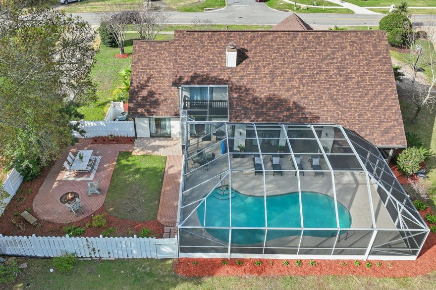 Welcome to 99 Country Club Dr. W, an elegantly updated contemporary home situated on a rare half-acre golf course lot in the sought-after Indian Bayou community in Destin Proper. This striking white-brick home offers 3479 sq. ft. of heated and cooled living space and showcases modern updates and designer finishes throughout. The first floor features a private master suite along with a dedicated office and powder bath, while the second floor includes two spacious guest bedrooms, a full guest bath and a versatile bonus room perfect for a media space, playroom, or additional work area. The heart of the home is an impressive, renovated kitchen with new cabinetry, premium appliances and modern countertops. The open living area includes an updated wet bar ideal for entertaining. Outdoors you'll find a beautifully designed screened-in living area and sparkling pool, creating a perfect indoor-outdoor retreat and the additional open patio with a firepit. Both areas offer sweeping views of the golf course and an ideal setting for relaxing evenings. A large front yard and a two-car garage add to the home's appeal. With new flooring, updated cabinetry, refreshed bathrooms, and thoughtful enhancements throughout, this move-in-ready property combines contemporary style, comfort, and an exceptional golf course setting in one of Destin's most desirable neighborhoods.