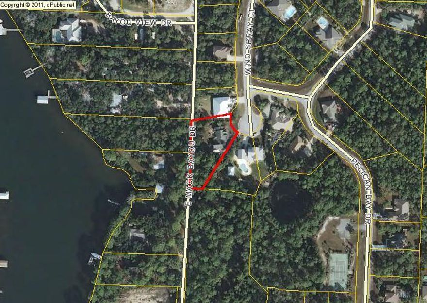 What a location! This home is located in the sought after Pelican Bay gated subdivision in Mack Bayou area! Priced to sell it is 100K less than any other house in the neighborhood. This home is being sold AS IS. If you are in the market for a fixer upper, this home is perfect. Owner priced for repair allowance. Only home with separate entrance driveway into the property from East Mack Bayou. Subdivision has tennis court and common bayfront dock facility. Great family neighborhood! Close to hospital, outlet malls and state parks!