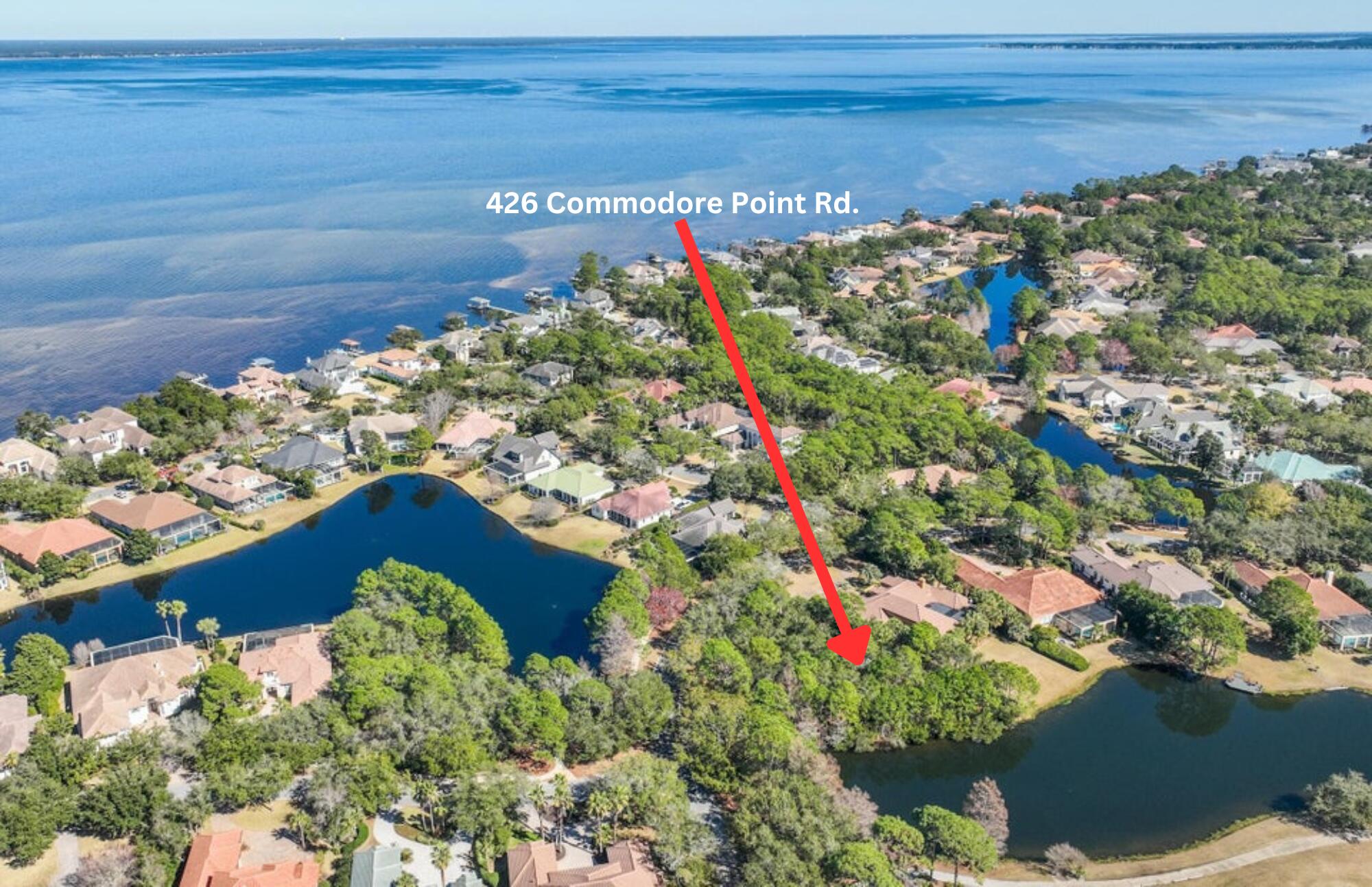 Less than 2 miles from the beach! Build your dream home in one of Destin's most desirable gated golf communities, Regatta Bay! This very large, beautiful waterfront lot is one of the biggest lots in Regatta Bay and offers the most amazing water views and of the Award-Winning Regatta Bay Golf Course! Regatta Bay is a quiet, gated, golf & boating community that offers a LIFESTYLE unlike no other! The Regatta Bay Lifestyle is all about convenience! You can use your golf cart to get to so many fun places in minutes, including the Beach! Within Regatta Bay, there is golf, swimming, tennis, pickle ball, park, playground, The Regatta Bay Clubhouse, Legendary Marine & Legendary Yacht Club.