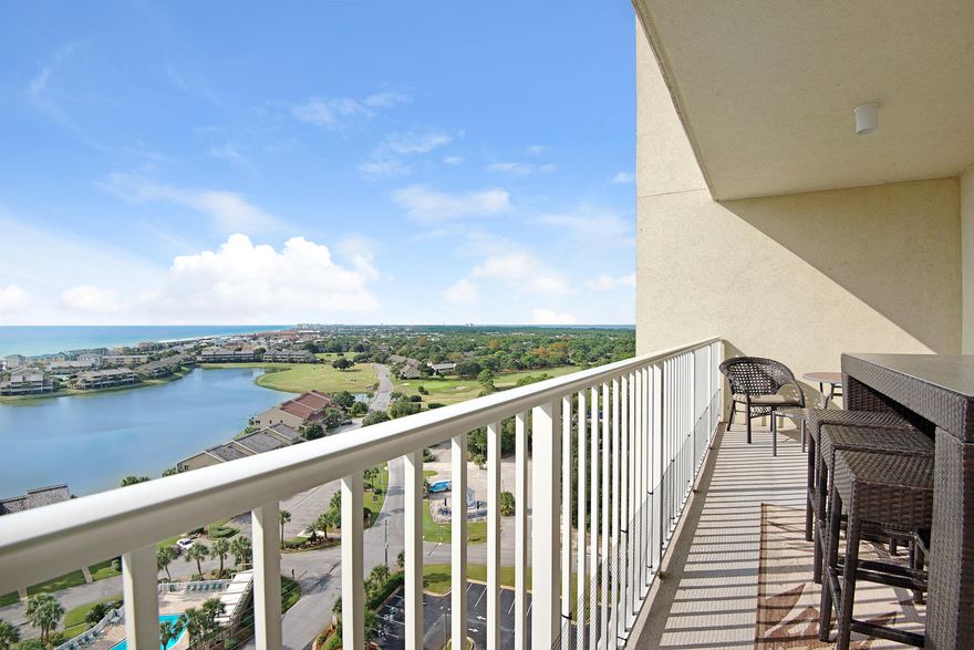 It's a Knockout!! This unit has an incredible views of both the Gulf and Lake. The current owners spared no expense to put the very best finishes in the unit and have furnished it exquisitely. Upgrades include: Santa Cecilia granite counter tops, stainless appliances, Autumn kitchen cabinets, Moen fixtures, state of the art ceiling fans, and Crown Molding galore. As you enter the condo you'll pick up the beautiful blue/green waters of the gulf against the smooth, dark wooded living area flooring leading out to a full size balcony. Enjoy all the great amenities that this gated community has to offer with 2 of the largest pools in the area,a fully equipped fitness facility,Cabana Caf restaurant,golf and tennis as well as deeded beach access to over 2,000sqft of beautiful white
