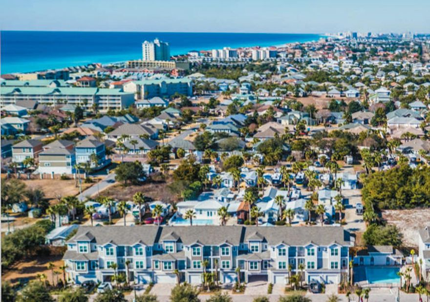 Brand new construction in Miramar Beach, less than a 3 minute walk to the beach and built to maximize return on investment! Driftwood Drive is a 20 unit complex with 2 floor plans. The 4 bedroom floor plan has porcelain tile on the first floor and a large bedroom with built-in bunks, tons of storage, and bathroom. The second and third floors have real oak hardwood flooring and balconies throughout with trex decking and aluminum rails. The kitchen boasts AristaCraft soft-close cabinets, granite counter tops, stainless steel Frigidaire Gallery appliances, and a large maple wood island table. All units have 9 foot ceilings, 5 -1/4'' crown molding, impact glass windows, 2 sets of washers/ dryers (1st and 3rd floor), 3 Carrier heat pump air conditioners (one per floor), LED light bulbs throughout,