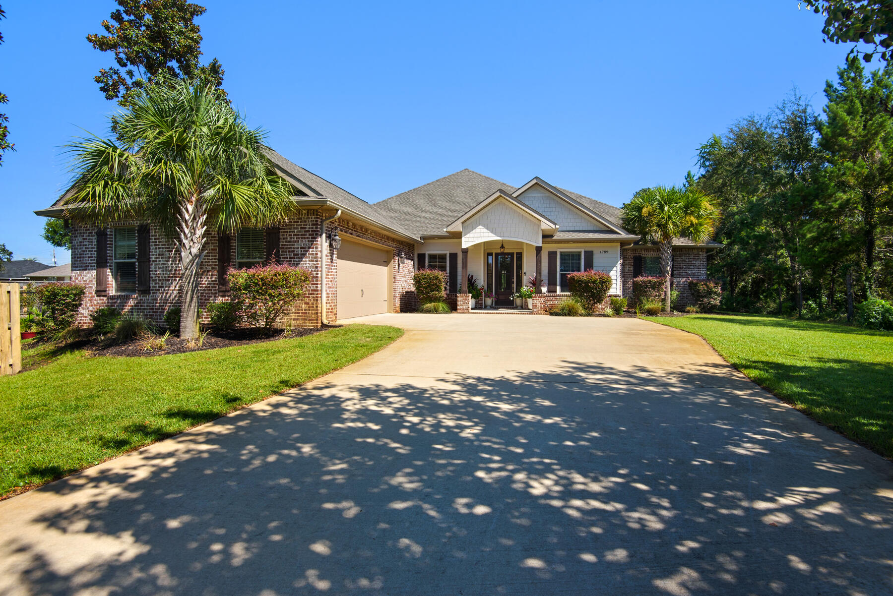 Stunning 2021-Built Home with Resort-Style Amenities in NavarreThis beautifully designed 4-bedroom, 3-bath home offers spa-like living inside and out. Enjoy your own private oasis with a heated pool and hot tub enhanced by ambient lighting and lush landscaping. The open-concept kitchen flows seamlessly into the living area, creating the perfect space for entertaining family and friends.Each bathroom is thoughtfully connected through an energy-efficient tankless hot water system, ensuring endless comfort. The oversized two-car garage provides ample storage and parking, with additional driveway space available.Located in a gated community, residents also enjoy access to a community dock and picturesque surroundings. With its blend of luxury features and coastal charm, this is this is a rare opportunity to own a move-in-ready home in the sought-after Navarre area. More photos to come shortly