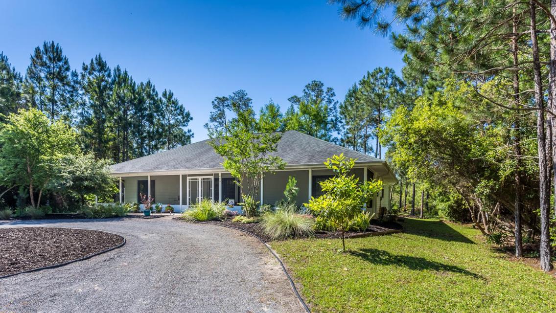 UNDER CONTRACT w/ KICKOUT CLAUSE of 72 hours or less. Nestled amongst tall pines on private gravel road, Old Seagrove meets Santa Rosa Beach, a quick golf cart or bike ride (on the new sidewalk being constructed) to the sandy beaches of Ed Walline. This 4 bdrm 2 bath home has everything you're looking for and is ready to generate a potential $50k/yr. It has 2 Master suites. Large 1/3 acre lot w/ plenty of room for a pool and outdoor kitchen. Zero maintenance landscape, long driveway for 8 cars/RV/Boat! Minutes from Gulf Place and all it offers: shopping, dining and concerts. There is a boat ramp w/ bay and ocean access just a mile north. Ride your bike down to beach or to Shunk Gulley or Perfect Pig for happy hour! No HOA! No flood zone! Don't just visit; live here!