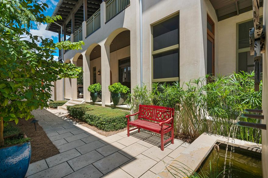 From the moment you first encounter this meticulously maintained 4 bedroom, 4.5 bath property, you will discover a spectacular residence beautifully decorated from top to bottom that is the ultimate entertainer's dream. The welcoming courtyards, private outdoor space with cozy fireplace, and spacious open floor plan flooded with natural light and high ceilings, makes this the home you've been waiting for. The Great Room and open concept gourmet kitchen with large island, granite counters and top stainless steel appliances offers a stylish contemporary ambiance. The first floor also boasts a sun drenched screened porch and private bedroom with bathroom, ideal for guests. Upstairs the oversized master suite with spa like bath provides access to the wrap around balcony with ample sitting ar