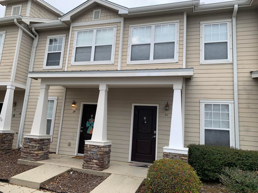 Welcome to this lovely 2 bedroom, 2 1/2 bath townhome in the Verandas of Freeport! You'll love the spacious open floor plan that combines the living, dining, and kitchen areas. Plus, it features beautiful granite countertops, a breakfast bar, and a covered back porch--perfect for relaxing!