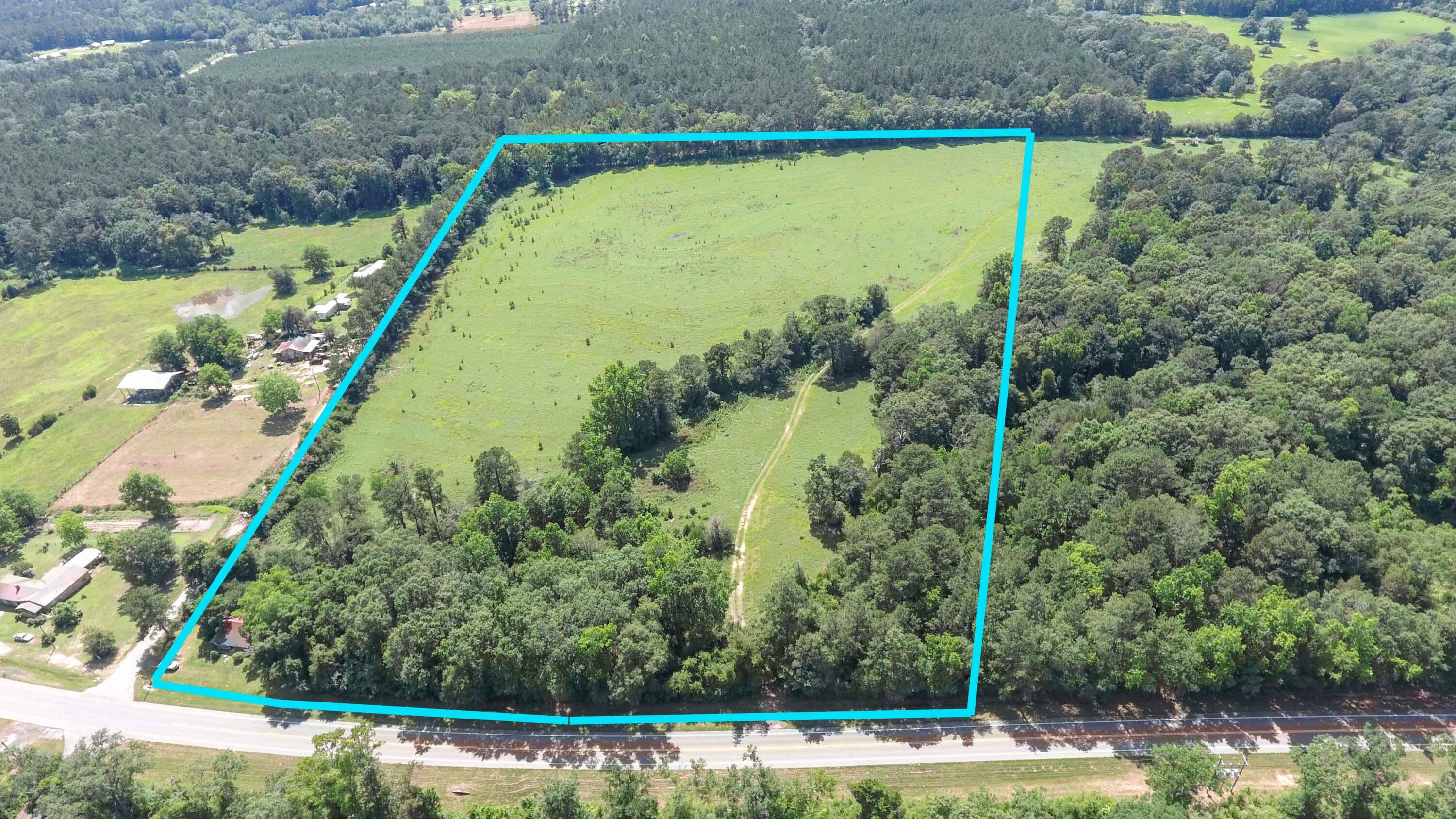 30.7 Acres (approx) located on St Hwy 81, just South of Ponce De Leon. Property has a land use of General Agriculture and is Zone X. The majority of the property is cleared pasture making it easy to turn into your Country Paradise. There is an old house on the corner of the property that has been given no value. Power has previously been to house plus a septic and well ( not known if they work - as-is). Several fruit trees are planted in that area. Some remains of original cabin are also on the property. Property is located just a few miles from Morrison Springs County Park for great water recreation activities. Location also makes easy access to South Walton and Panama City.