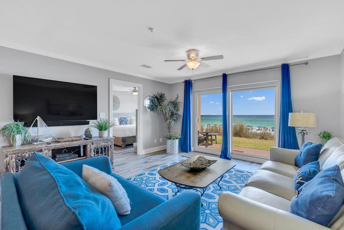Shimmering views of the Gulf of Mexico await you at this ground-floor unit at Emerald Dunes. Located within the exclusive Crystal Beach community of Destin, this pristine condo provides a luxurious space complemented with soft tones and coastal decor. Unit 103 features an open concept floor plan with hardwood tile floors, crown molding, granite countertops and stainless steel appliances. The gulf-front master suite features stunning views and an updated bathroom with double vanities, a tiled walk-in shower and a soaking tub. This unit comes with proven rental history and is booked solid through August. Emerald Dunes is a gated complex with a community pool, hot tub, grilling area and beach access. Unit 103 is being offered fully furnished and