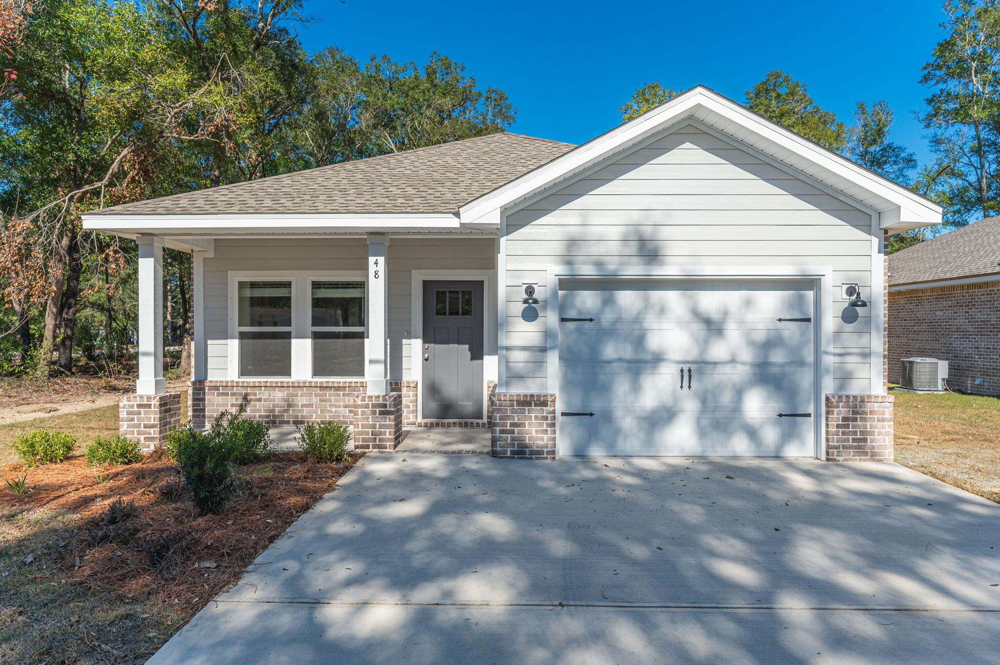 NEED IT BY THE END OF THE YEAR?  We have the perfect NEW all brick home!  Privacy fence, landscaping, sprinkler system.  Cozy front & rear porches, raised ceilings in family/kitchen/dining area, recessed lighting and ceiling fans throughout.  Kitchen features white shaker style cabinets, stainless-steel appliances, large walk-in pantry plus work island with bar seating.  Owners bath has double vanities, linen storage, walk-in closet and tiled shower.  Luxury vinyl plank flooring + carpet in bedrooms.  Seller will pay up to $10,000 towards buyer closing costs and/or prepaids and/or rate buydown - restrictions apply.  End of December Completion, photos of completed sold home - front elevation and colors (interior/exterior) will vary.