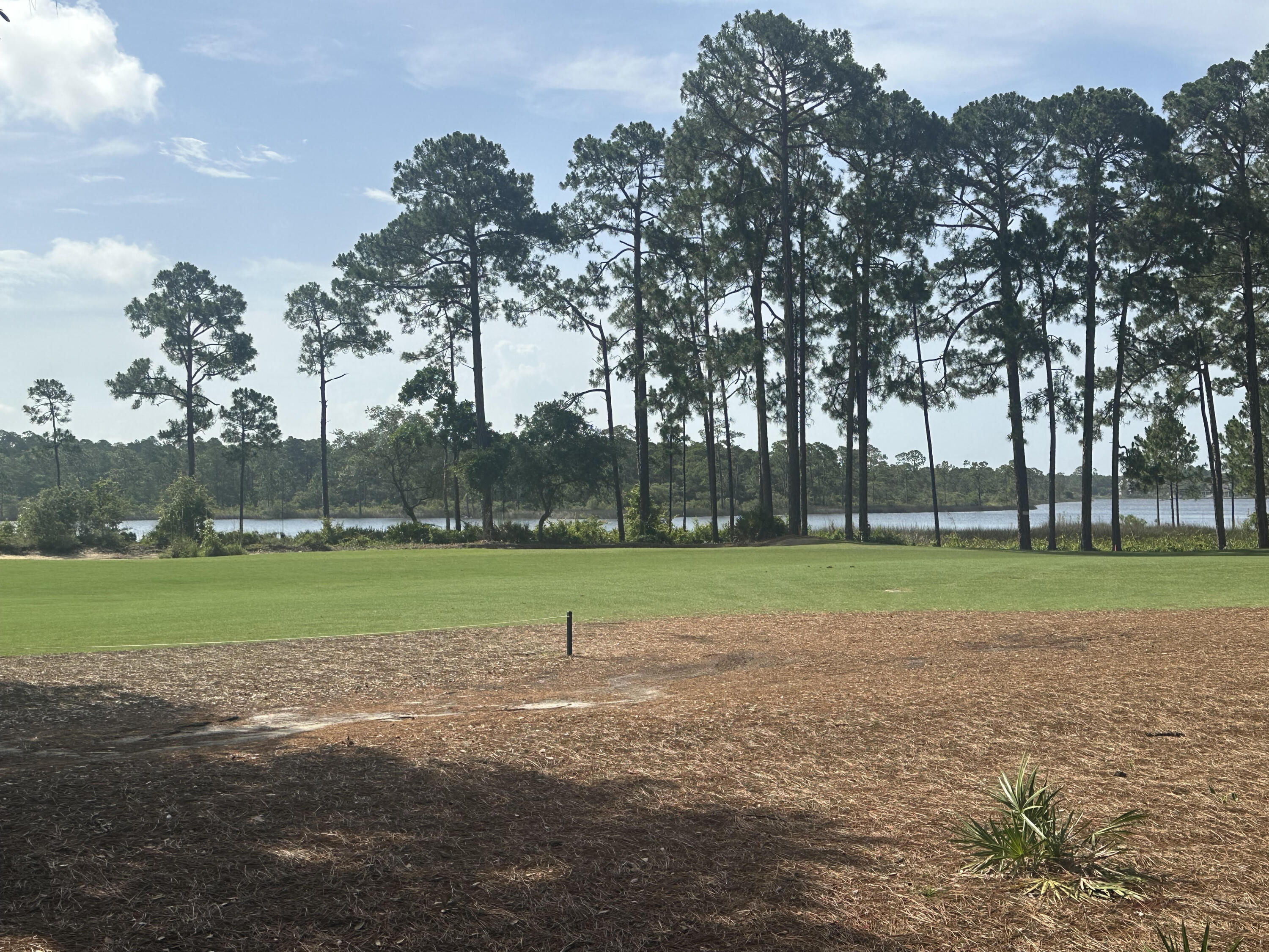 Leave the bustle of tourist traffic and 30A behind and come home to the tranquilty of Wild Heron. Just minutes from 30A and Pier Park, this EPIC lot sits alongside the 6th fairway of the acclaimed Sharks Tooth golf course and has STUNNING views of Lake Powell. it is truly one of the very BEST lots in Wild Heron. At almost 2/3 of an acre, you can build a very large home with a large pool and backyard sanctuary. PLUS, a leased BOAT SLIP, at the amazing Wild Heron marina, conveys with the purchase of this lot. Preliminary home plans have been produced and can be provided with the sale. GOLFING, BOATING, FISHING, or just RELAXING with great neighbors, you have found paradise and can call it HOME! Before a contract, a free onsite consultation with an approved Wild Heron builder and and architect can be arranged to help make your dream come to life! This amazing coastal sanctuary borders Lake Powell, the largest coastal lake in Florida and you will feel the peaceful atmosphere as soon as you drive in. Just minutes from 30A, beaches and Pier Park, this exclusive gated and guarded community is luxury living at its finest with incredible amenities and the renowned private membership, Greg Norman designed Sharkstooth at Watersound golf club. Amenities include a large, heated community pool, hot tub, large gym, boathouse, dock on Lake Powel - the second largest brackish lake in the world, fire pit, trails, event lawn, and other. Wild Heron is a very social neighborhood with summer concerts, holiday parties, weekly food trucks and farmers market, yoga, dance exercise, water aerobics, and many other activities. Watersound Club is available to join and includes not only the acclaimed Sharkstooth Golf Club and the new "Third" Links golf course, but access to Camp Creek golf course, Camp Creek Inn w/Pool and gym, the Watersound Beach Club, Clay shooting course, and on-site clay lighted tennis courts. You are only a few minutes from Beach access 87 which is right down Kelly Street. Sunsets on Lake Powell are amazing and fishing, boating, kayaking and paddleboarding are frequent activities.