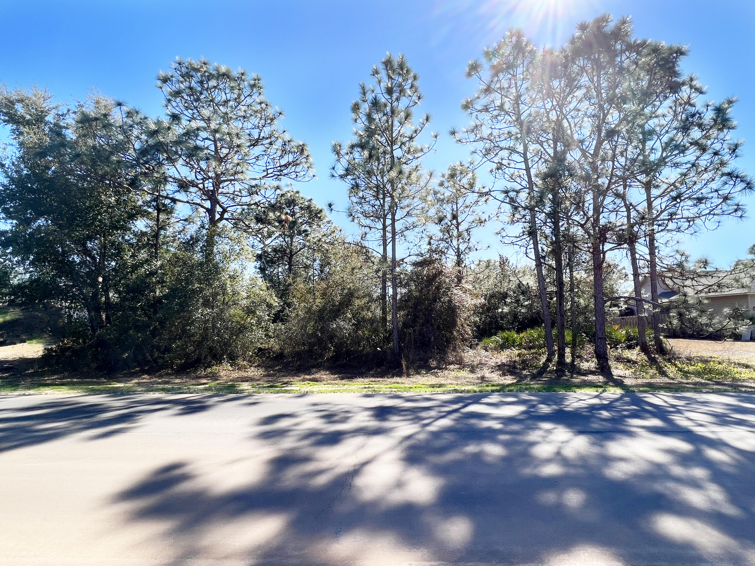 BACK ON THE MARKET - Buyer Financing Fell Through - GORGEOUS Holley by the Sea, Near Half Acre, One-of-a-Kind Lot for Sale in an EXCELLENT Location with NO WETLANDS and is FLOOD ZONE X. Natural Gas and Public Sewer is Available on this lot! Located Across the Street from HOA Owned Green Belt Area and the West End of Frankfort, which Provides for Minimal Traffic and Additional Peace and Privacy. Build your Perfect Dream Home with an Abundance of Land or Perfect as an Investment Property! In addition, this Lot is Located Close to Highway 98, close to the Recreation Center, Navarre Beach, Shopping, Dining, Schools and Commuting. Natural Gas is Available on this Street and at the Lot, and Wetland Study is Recent as of July 2021. Flood Zone X and No Wetland Lots are a Rarity! Holley By the Sea is a Wonderful Community to Live in with Low HOA Fees and Amazing Amenities, such as the 50 ACRE Recreational Center and Grounds, Multiple Swimming Pools, Gym, Sauna & Steam Room, Basketball Courts, Tennis Courts, Playground, Boat Launch on East Bay, and Dock & Beach Area on the Santa Rosa Sound! Additionally, nearby is the Hidden Creek Golf Course, an 18-Hole Championship Golf Course. Navarre/Navarre Beach is Lauded to be One of the Best Locations to Buy a Beach Home and Investment Property!