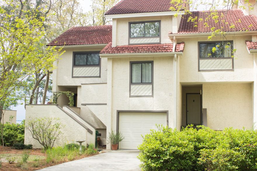 Picture perfect! Beautiful end unit townhome in Bluewater Bay's Marina Cove Village development. You enter this home's foyer and are immediately swept away by the amazing views from the living area! The sitting area, dining and kitchen, complete with equally amazing views, are just a few steps away. Nicely updated kitchen has upgraded cabinetry and granite countertops, built-in wine rack, and DO NOT MISS the pantry...it's dreamy. Wood flooring in kitchen and dining area, tile in bathrooms, and carpet in bedrooms and living areas. The master bedroom enjoys more of the bay views and has its very own loft. Termite bond in place for new owner's peace of mind. This unit is just a stone's throw away from the marina. Pool and other Bluewater Bay amenities are offered for a separate fee.