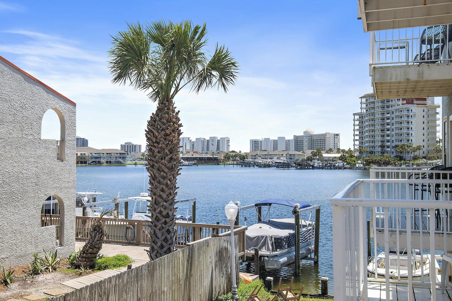 Comes fully furnished turn-key, with deeded beach access and boat slip available for rent from the COA, at a low cost. Laguna Point Complex sits on the Harbor. The first floor is a one car garage with room to spare for storage. The second floor features amazing water views, kitchen with granite counter tops, stainless steal appliances and a large living area. Third floor provides two bedrooms with their own bathrooms and ample closet space. Quiet balcony with harbor views. A short distance, just a block away to the gated/deeded beach access. FEATURES : Harbor front, boat slips available for rent, small complex (16 units), new roof in 2020, great location, COA protected, exclusive gated beach access. Laguna Point Condos are VA approved.