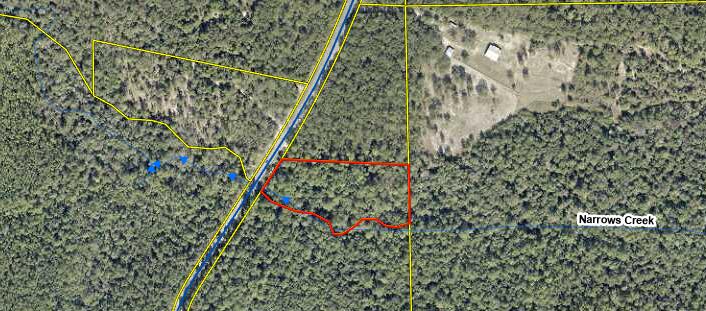 Prime waterfront parcel in DeFuniak Springs with 655+/- ft on Narrows Creek and 150 feet of frontage on King Lake Rd. Over 2 acres of serene, wooded land with open areas--ideal for a custom home, cabin, or recreational retreat. No HOA or known restrictions. 10 Minutes to downtown DFS and within 1/2 mile of the new Upper Shoal River State Park. www.tpl.org/our-work/upper-shoal-river45 minutes to the pristine sandy beaches of Walton County. Enjoy kayaking, nature watching, and privacy surrounded by large tract parcels. Paved road access and nearby power. Zoned for rural village use ~ 2 homes per ac. Buyer to verify all zoning, utilities, and build requirements. Don't miss this unique opportunity to own a beautiful slice of Florida paradise.