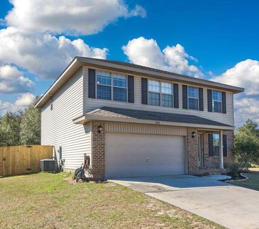 Home with 4 bedrooms and 3 bathrooms, centrally located in Crestview. The kitchen and the main area have laminate flooring. A large living area with vaulted ceilings makes the space feel airy and open. On the main floor, there is a bedroom and full bathroom. Kitchen with a wraparound design has plenty of cabinet and counter space. 2020  Bosch dishwasher and refrigerator.  Laundry area is concealed and attracts attention with a shiplap accent wall and a barn door for a rustic appearance. Upstairs features a master suite as well as two additional bedrooms with an additional shared bathroom.  Fully enclosed, level backyard with newer fence! There is no through traffic, home is located on a cul-de-sac!