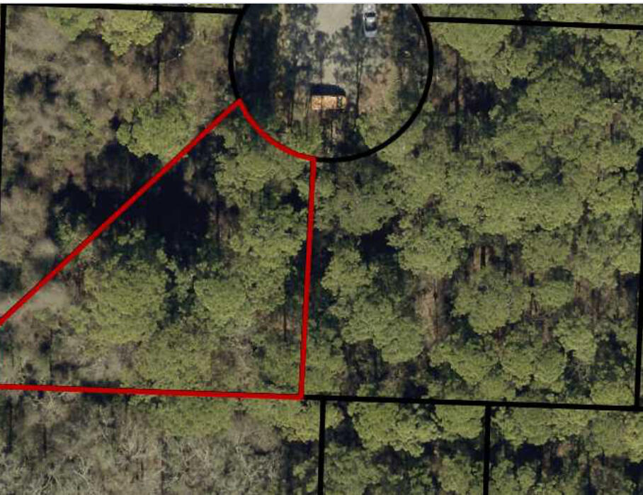 Wooded residential lot with a suitable dry pad for a future home site. Located near Navarre High School, NYSA & YMCA. Portions of the back and left side of the lot include wetlands. Public water service is available, and public sewer is located along Deer Lane with potential access subject to demand (per Holley Navarre Water & Sewer).All information is deemed reliable but not guaranteed and should be independently verified by buyer.