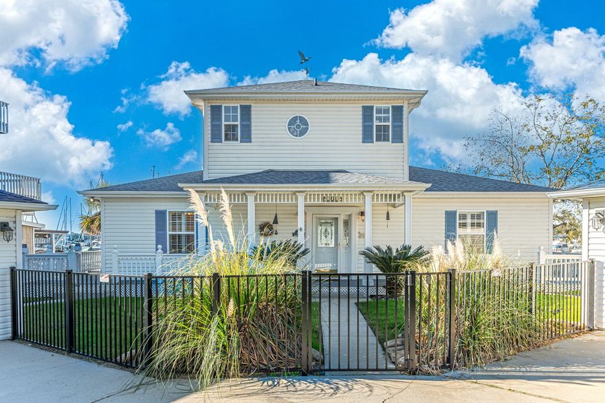 UNDER CONTRACT. ACCEPTING BACK-UP OFFERS. Experience the essence of waterfront living. This  deep water home is a boater's dream, nestled along the serene shoreline of Boggy Bayou, adjacent to the marina and 850 Wharf restaurant -- your days will be filled with nautical adventures and gourmet dining. With two detached 1-car garages, one primed for a lock-out suite conversion, this property offers endless possibilities. Enjoy the sunset from your private screened balcony or entertain on the expansive wraparound deck, accessible from the main living areas. This low-maintenance oasis is perfect for boat enthusiasts, offering easy access to the bayou and bay,  and minutes away to Crab Island and the Gulf of Mexico.