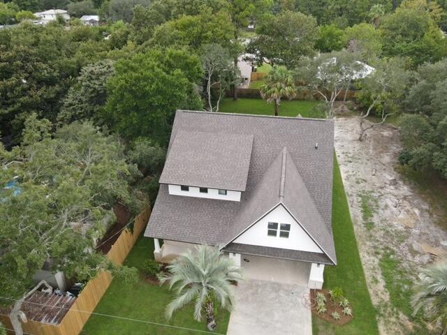 Captivating, elegant new construction home in Destin with smooth, sleek lines and contemporary bungalow appeal. Surprises everywhere! Gorgeous white granite, enormous center isle in sunny kitchen with farmhouse sink, cool drop lights, stunning backsplash and walk-in pantry. Spectacular oversized windows take in the expansive view of beautiful green grass in back yard. The kitchen is open to the great room for ample, welcoming entertaining. Master suite on the first floor has sumptuous soaking tub and luxurious shower. Private office on first floor, and dramatic stairwell. Laundry room with granite window seat and built-in cabinets. The second floor has an enormous loft or lounge area, and a gambrel bedroom with its own foyer and two more bedrooms. Designed with style and elevated architectural features. Two minutes to Joe's Bayou public boat ramp and park on the Choctawhatchee Bay, five minutes to Destin Harbor, and ten minutes to Gulf of Mexico public beach.