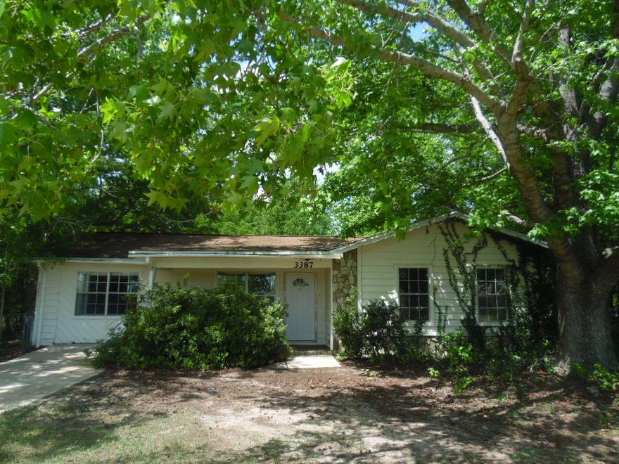 So many possibilities for this 3 bedroom, 2 bath REO home on a corner lot with beautiful trees and a pool! The back yard is fenced and has a shed for storage. The kitchen has had some remodeling done and the location is an easy ride to shopping, schools, and employment opportunities.
