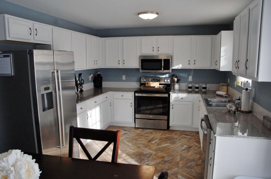 Come and see this beautiful like new home. Great split floorplan with handsome tile in kitchen and baths. New vinyl wood flooring in main areas. Freshly painted through-out. The kitchen is appointed with granite countertops and all stainless steel appliances and plenty of cabinet space. Newly installed sliding barn door separates the additional guest rooms, hall and bath. This home both offers the best of both worlds, beautifully renovated home with plenty of privacy and space in Triple Lakes Estates subdivision. Huge backyard that is fully fenced with new fencing and double sided doors on one side that offers plenty of room for boat storage, etc. This home is in an ideal location for privacy and also right down the road from Crestview, Defuniak Springs 285 to military bases and Destin or South Walton beaches.