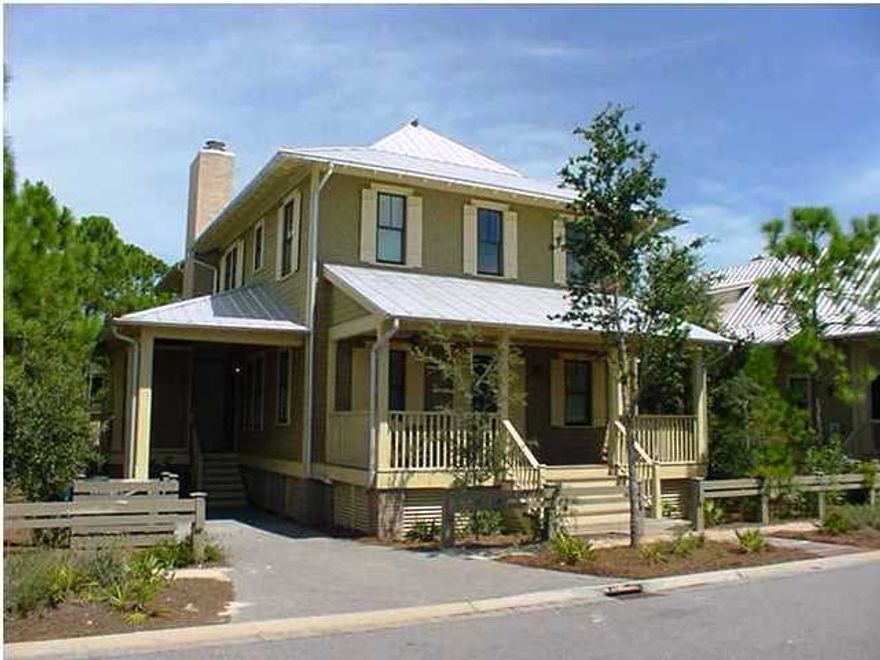 Located in Phase II of Watercolor, this sensational home offers the ultimate in indoor and outdoor living featuring 4 Bedrooms and 4 baths, and almost 1,000 square feet of balconies and screened porches. This home borders a natural preserve and features an array of extraordinary finishes including beautiful wood floors, wood-trimmed walls, high-end stainless steel appliances, marble faced gas fireplace, and raised ceilings. The main floor features a two story foyer leading to a huge open kitchen, great room & dining area. The living area features a gas fireplace, beamed ceiling, and wood trimmed walls. It also opens to an expansive screened porch which leads to an open deck with brick fireplace and grill. The large and open gourmet kitchen has it all...upgraded appliances including an