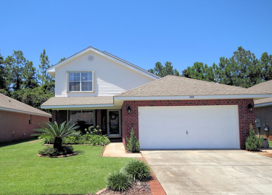Motivated Seller!! Gorgeous home built in year 2004 with 4 bedrooms and 2.5 bathrooms and 2135 sq ft located in the Marsh Harbor Subdivision. This community is on the Santa Rosa Sound with deeded water access and features a neighborhood boardwalk to the private beach where residents can enjoy the sunsets, beach, paddle boarding, kayaking, and watching dolphins play! The community is only minutes to the beaches and the military base! This two-story home has the master bedroom on the first floor! The home is immaculate and move in ready! Enter the foyer and notice the wood laminate flooring in the living and dining room and new vinyl flooring in the kitchen! The kitchen features a stainless side-by-side refrigerator with icemaker, smooth cooktop stove and oven, built-in microwave, dishwasher and disposal! The kitchen is exquisite with the tiled back splash and the chrome hardware and faucet! There is a peninsula that seats up to 3, which is great for entertaining! Every kitchen needs a pantry and this kitchen has a walk in kitchen pantry! The living room has vaulted ceilings, ceiling fan, fireplace, and French doors to the enclosed / screened patio! Exit onto the enclosed patio (10x19) and notice the 18 inch tile and ceiling fan! Also there is private access from the master bedroom into the enclosed patio! The master bedroom is large and features an ensuite bathroom! The master bathroom features a double vanity, tub/shower combination, newer faucet and fixtures and a tiled backsplash! There is a half bathroom for guest on the first floor! On the second floor there are three additional guest bedrooms and a full bath! The bath features a double vanity with tiled back splash, two large mirrors with separate vanity lights and a tub/shower combination! There is so much room in this bathroom! This home has gorgeous and mature vegetation! The backyard is an oasis! There is a large privacy fence on the rear of the lot and vinyl fencing on the sides. The roof was replaced in 2003! The HVAC is still under warranty and was replaced in approximately 2013 yr! The palm trees on the lot are perfectly maintained! Also, the home comes with accordion hurricane shutters. Just outside of the enclosed patio there is an extended paver patio for outdoor entertaining! There are also gutter systems on the exterior! The home features a nice laundry room that does have space for front loader washer/dryer! This home is on the perfect lot in a very desirable location! Buyer to verify all dimensions and information!