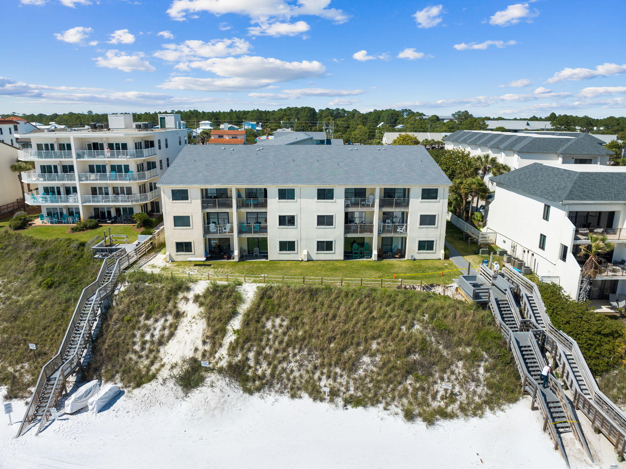 Experience the ultimate beach lifestyle in this stunning condo at Beachside Condo at Seagrove. Wake up to morning strolls on the white sandy beach and emerald green waters of the Gulf of Mexico just a short walk away. This fully furnished home boasts 2 beds and 2 baths. Beautiful white quartz countertops, stainless steel appliances, and a farmhouse sink adorn the kitchen. The master bedroom offers up a stunning view of the Gulf, while the guest room enjoys a view as well. Enjoy breathtaking sunsets from the private balcony on the third floor. This well-maintained complex offers a beautiful pool and lush landscaping.