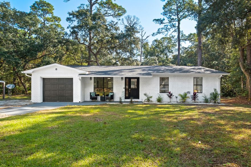 Under Contract, taking backup offers. Nature Lover's Paradise! Come home to your own peaceful private retreat, with song birds and butterflies, nestled on a tree lined lot without a neighbor in site, on over half an acre.  Motivated seller will include a home warranty for a reasonable offer under contract. Despite the hype-Buyer may qualify for a 4% interest rate on first two years of mortgage loan with our lending program, and buyer can refinance under a new rate, post interest hike . Featuring 3 bedrooms, 2 bathrooms and an open concept living/dining area, this home is ready for its new owner.  2022 renovations include stainless kitchen appliances, new roof, new HVAC and ductwork, insulation, septic, interior and exterior paint, water heater and landscaping.