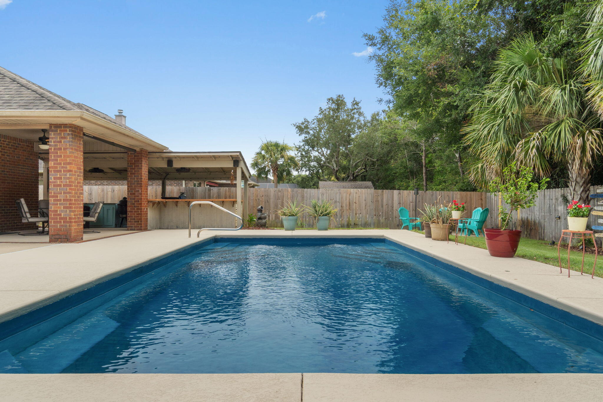 Nestled in the premier community of Grand Bay Estate, this stunning single-level home is perfect for families seeking comfort and a vibrant lifestyle. With 4 spacious bedrooms and 2.5 bathrooms, this residence is designed for both relaxation and entertainment.Bring your paddle board and kayak! Enjoy the well-maintained neighborhood with sidewalks, and take advantage of the private dock for fishing or simply unwinding by the water. Don't forget your swimmies! your own private pool awaits for those sunny days!As you step inside, you'll be greeted by fresh paint and gorgeous new flooring that extends throughout the home. The well-equipped kitchen boasts staggered cabinets, granite counters, and elegant crown molding, all overlooking a large, inviting family room--perfect for gatherings. Retreat to the master suite, where luxury meets functionality. Featuring a spacious walk-in closet, a relaxing garden tub, and a separate shower.
Step into the beautifully landscaped backyard, an entertainer's paradise! Enjoy outdoor grilling in the well-appointed outdoor kitchen, gather around the cozy fire pit, or dine al fresco in the covered eating area, all while overlooking the sparkling pool. Termite bond in place and new roof coming soon.
This home offers warmth, beauty, and a lifestyle to cherish for years to come. Don't miss your chance to make it yours!