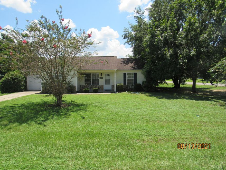 This charming 3-bedroom, 2-bathroom home is nestled on a spacious, level, corner lot in south Crestview. The privacy-fenced backyard features an inviting open deck, perfect for outdoor living, and there is a one-car garage equipped with laundry hookups for added convenience. Inside, you'll find neutral paint, vaulted ceilings, and a spacious living room. The kitchen boasts ample counter and cabinet space, a flat cooktop stove, and a pantry, while a formal dining area provides an elegant space for meals. The split floor plan ensures privacy, with the primary bedroom offering its own full bath and the two guest rooms sharing a second full bath. Pets may be considered on a case-by-case basis with owner approval and a non-refundable pet fee.