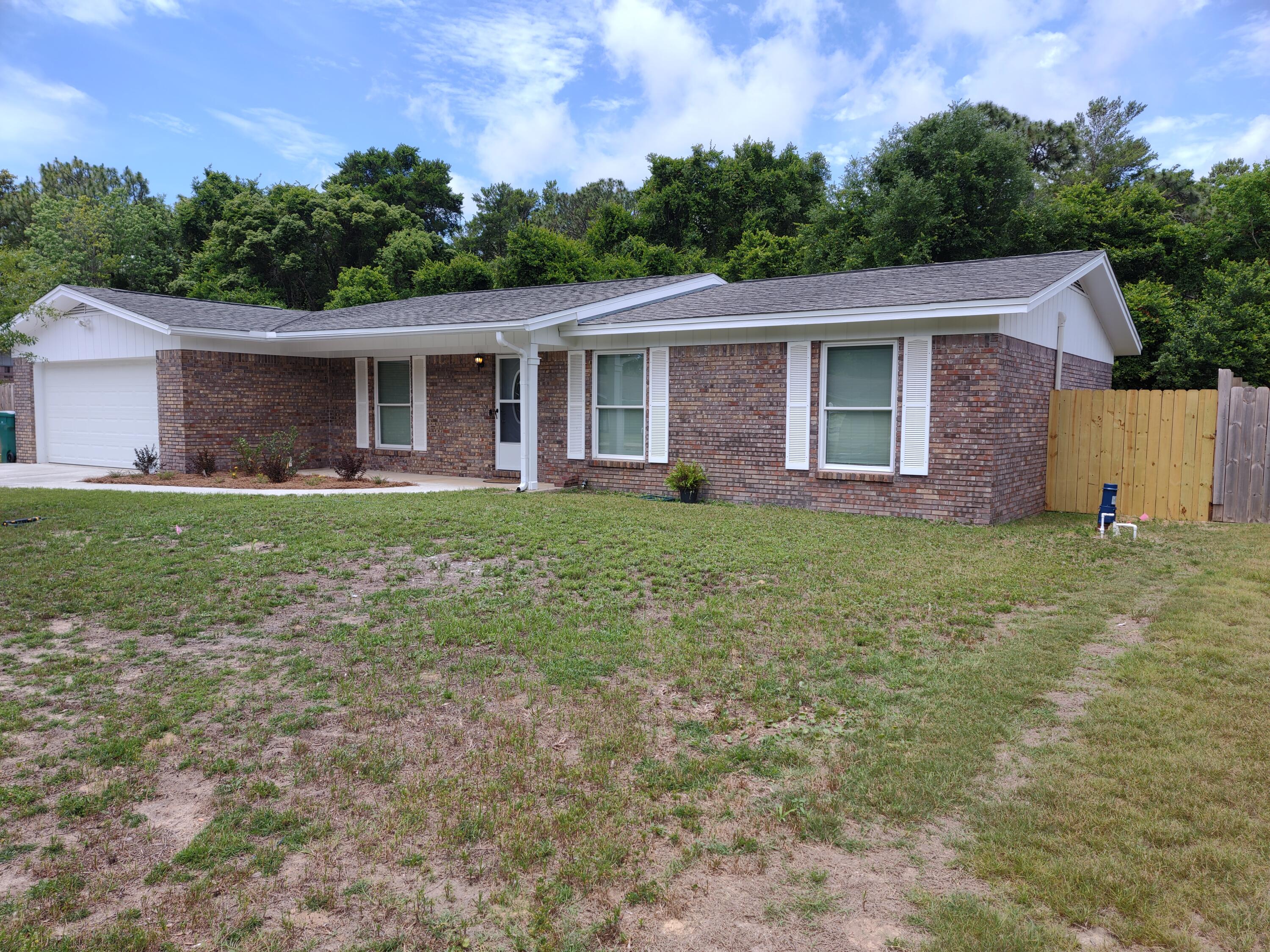 This wonderful home has had updates to the Floorplan, electrical, plumbing, HVAC, kitchen, baths, flooring and so forth. The owner had the living area opened up giving a spacious feeling. The kitchen has new cabinets featuring soft close drawers and doors. The counters are quartz. The center island features a down draft Cookson and breakfast bar area. New refrigerator, dishwasher and oven. Heating and AC has been updated including duct work. Electrical wiring has been updated. Master bath has been remodeled with new tile, vanity and fixtures. Guest bath has had the renovation treatment also. New tub, new tile, new quartz vanity top. A patio door that opens to the screen porch is new and features built window blinds. Another patio door that gives the dining area access to an open patio is