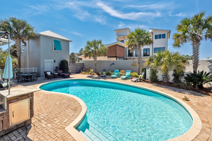 Welcome to your dream home in the prestigious Rolling Dunes Subdivision in Blue Mountain Beach. This luxurious property with gulf views boasts 5 spacious bedrooms plus a bunk area, 4.5 modern bathrooms, and is built to the highest standards. With a stunning carriage house and a large sparkling (heated) swimming pool, this home is the epitome of luxury living in one of Florida's most desirable areas. Perfectly located just 2 blocks from the beach, this property offers the ultimate coastal lifestyle. With a Master Suite on both first and second levels of the home, you'll be able to get all of your company together comfortably, even expanding into the Carriage House for additional privacy. The kitchen is a chef's delight, featuring elegant granite countertops and state-of-the-art stainless... ...steel, GE appliances. Outdoor relaxation is easy at this beach home! The pool is surrounded by an 8 foot block privacy wall along with a freshly-refinished deck and enough space to host multiple families. Satisfy their cravings while cooking up something on the smoker or grill in the outdoor kitchen. Then kick off your flip flops and enjoy the glass-fire pit. Imagine yourself relaxing in a pool-side hammock while your catch-of-the-day is cooking in the background!
Spend your days soaking up the sun and taking in the breathtaking views of the Gulf of Mexico. Whether you're a beachcomber, water sports enthusiast, or simply looking for a serene escape, this home is the ideal retreat. The open-concept floor plan of this home is perfect for entertaining, with plenty of room for family and friends. 
This property truly has it all, from the stunning amenities to the exceptional location. Don't miss your chance to own this piece of paradise. Schedule a showing today and experience luxury living at its finest.