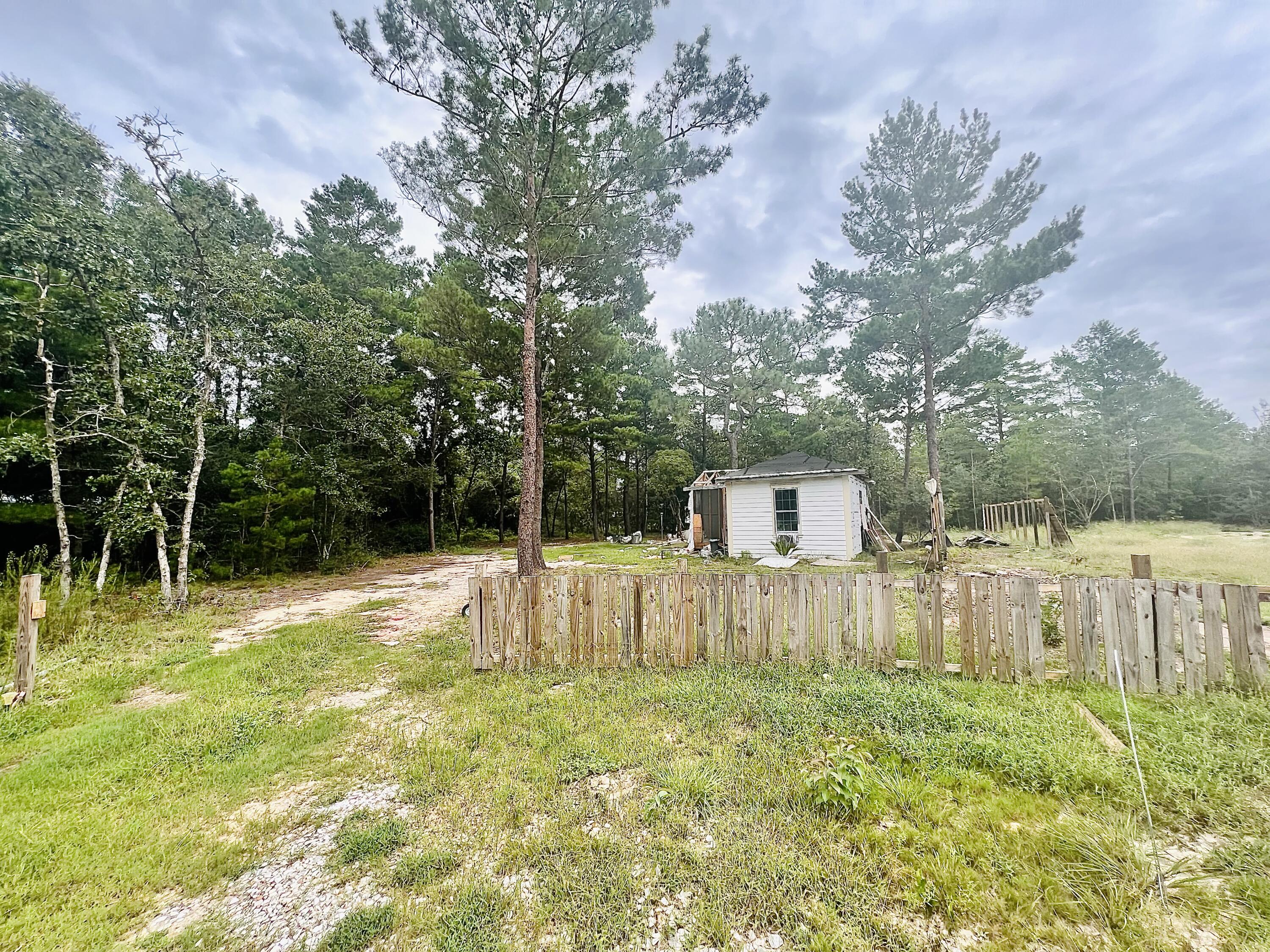 Great price for a lot on a cul de sac. Rural Area.NO utilities were ever hooked up. Requires a Septic Tank.There is a small unfinished building. You can tear the building down or repair it. Do with it what you will. There is items on the land such as plywood, and other construction items left from previous owners. Mossy Head Water Works can give you a quote to hook up water. Flood Zone X. Zoned RLD and RR. Buyer to verify all information and details to be correct.Sold As it. Cash Preferred.