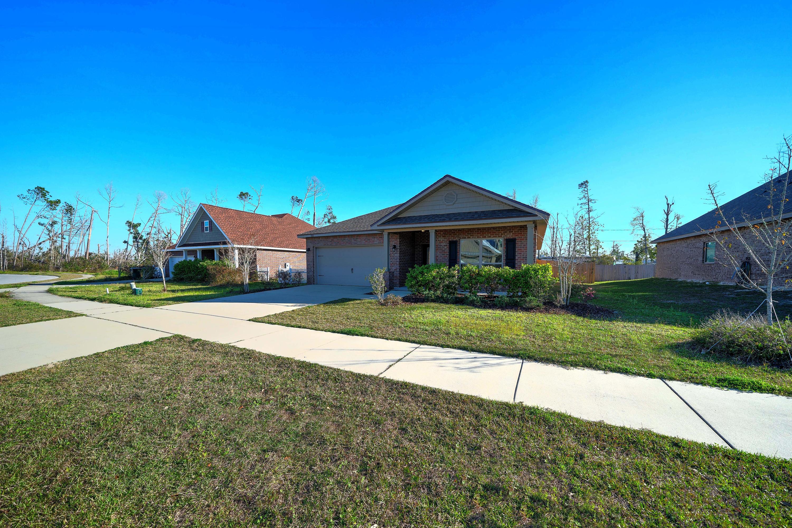 Welcome to this desirable, move in ready, Lynn Haven home by D.R. Horton. Located on a quiet one street subdivision close to Beatty Bayou. Features incl. 3 bedroom 2 full bath plus den, with bright and open floor plan. The large kitchen has granite counter tops, stylish cabinets, recessed lighting, a breakfast bar & separate area for dining. Master suite has large walk-in-closet, bath with garden tub, dual sinks, linen closet and separate shower. Beautiful trey ceilings in master bedroom and great room. Plenty of windows throughout the home offer lots of natural light. Newer engineered hardwood floors in main living area, tile in kitchen & baths and newly carpeted bedrooms. Relax on the beautiful covered patio in your private yard.This home won't last long, schedule your showing today!