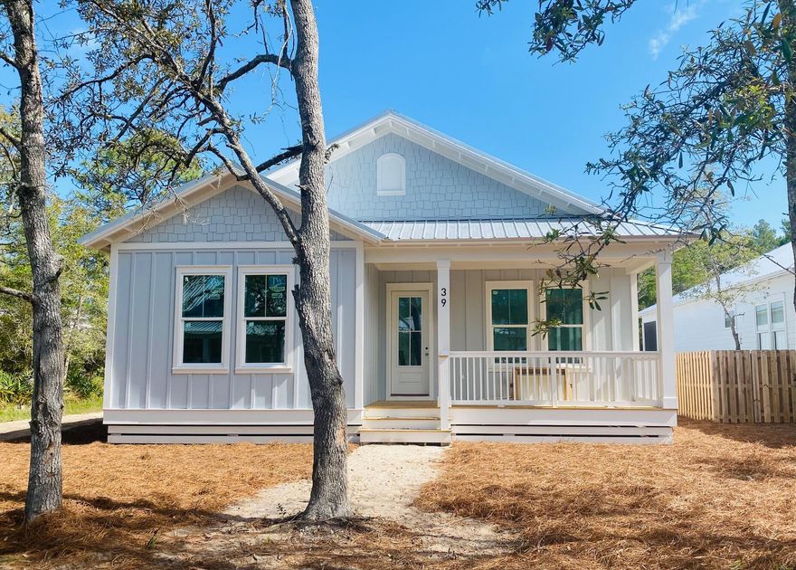 This charming home in Point Washington is almost complete. The single story Florida cottage features 3 bedrooms, 2 1/2 baths and a two car garage. The open concept floor plan features luxury vinyl plank flooring throughout and the home oozes charm with a ship lap accent wall in the living room, quartz countertops in the kitchen and large laundry room. The primary bedroom enjoys a generous closet and spa like bathroom with double vanities. There are two additional bedrooms that share a bathroom with double vanities and a  tiled shower and tub combo. Grayton Bayou residents enjoy a nice community pool with spa and there is a public boat ramp at the end of the street. This adorable cottage is just minutes away from the beautiful beaches of 30A.