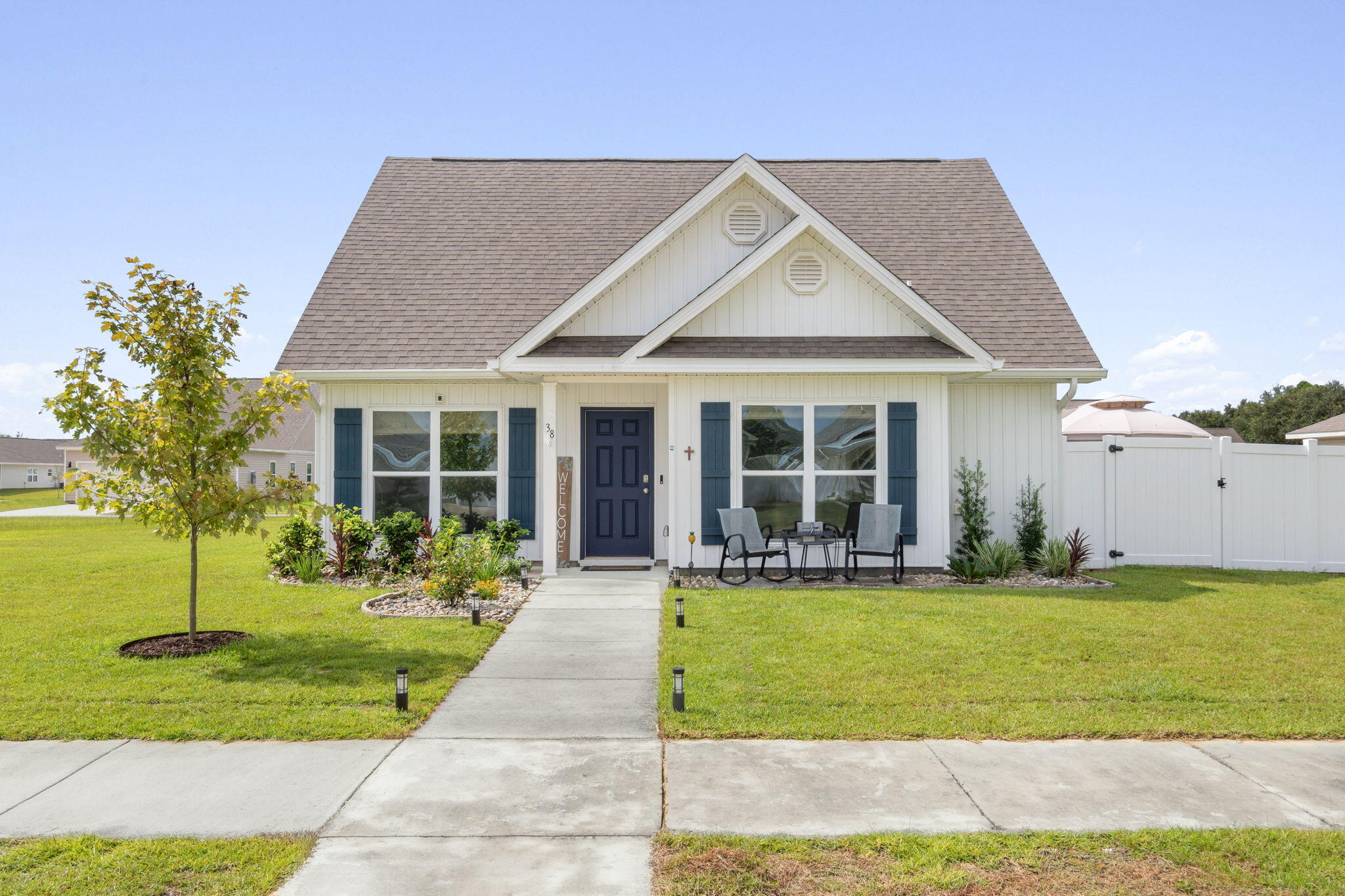 This gently lived-in-2 yr old home offers the rare blend of contemporary design, functional comfort, and an abundance of outdoor living space! A standout feature is the fully fenced large, private side yard (easily accessed from the living area) adorned with beautiful brick pavers, lush landscaping, irrigation and a soft-top gazebo that offers shade for outdoor dining, morning coffee or family gatherings. The LVP flooring seamlessly connects the living areas, while plush carpeting lends comfort to each of the 3 bedrooms. The split floorplan provides privacy for the primary bedroom and an open flow between the kitchen, dining and living spaces - ideal for entertaining. Additional features include: 2 car garage with interlocking flooring tiles, rain gutters, largest lot in the... subdivision with room on the other side of the house for water toy storage, upgraded ceiling fans, termite bond, and custom window treatments. Owls Head neighborhood offers walking trails, a neighborhood park and a spring-fed lake with shopping, dining, and schools just minutes away making daily errands and outings effortless. Come and see this amazing home with all it has to offer - you will not be disappointed!