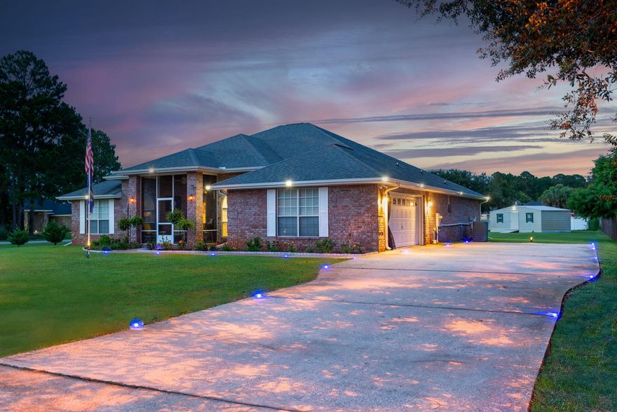 Luxury and Spacious Elegance Meets Comfort in This Stunning 4-Bedroom Home! This beautifully designed home boasts nearly 3,000 sq ft of living space on an oversized corner lot, offering the perfect blend of style and function. Featuring a large open floor plan, it's ideal for entertaining guests or enjoying family time with two generous living areas, a formal dining room, and an inviting sunroom that fills the home with natural light. The gourmet kitchen is a chef's dream--complete with custom wood cabinets, double beveled granite countertops, tile flooring, stainless steel appliances, DOUBLE oven, upscale lighting, drop lighting, and an extra-large walk-in pantry. Adjacent to the kitchen, the spacious breakfast area showcases beautiful bay windows and plenty of light.Amazing .74 acre lo lot big enough to build a pool or be creative! This home offers 4 large bedrooms and 3 full baths, including a private suite off the sunroom perfect for guests or multigenerational living. The Jack and Jill bath connects two bedrooms set apart for added privacy, while the luxurious master suite features trey ceilings, a sitting/dressing area, dual walk-in closets, and a spa-like master bath with double vanities, a deep soaking tub with custom tile backsplash, and a tiled shower. Home enjoys a formal Dining Room with plenty of room for entertaining guests and family; Extra large laundry room has a sink and lots of room for storage; Additional highlights include a dedicated office/music room with double doors, tiled fireplace with a beveled mirror, large linen closet, underground utilities! The Living Room extends into a beautiful Florida/Sunroom with lighting galore; A Big Plus is a large workshop/storage room in the larger .74  acre backyard. Enjoy the outdoors with a stone and brick patio area, perfect for grilling and entertaining. Holley By The Sea's premier amenities: pools, tennis courts, a fitness center, community house, picnic areas, fishing, and a boat ramp. Conveniently located near beaches, shopping, and top-rated schools, this home offers the space, comfort, and amenities you've been looking for! 