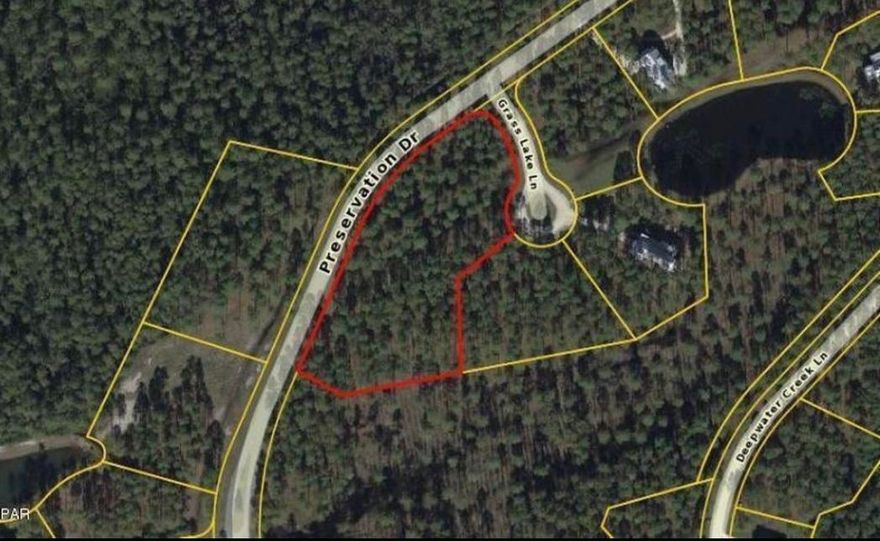 This 2.29 acre wooded lot is by far one of the largest lots in Rivercamps. If it's space and convenience you are looking to build your dream home on look no further. The community is located 5 minutes from the Northwest Florida Beaches International Airport, 2 mins to boating/fishing and 10 minutes to the beach and shopping. Rivercamps has 1500 gated acres with a boat launch on crooked creek that leads to the Gulf of Mexico. Amenities include a Riverhouse with a catering kitchen, dining area and library. The waterfront pool area complete with grill area and screened patio is perfect for gatherings. Boat slips, 600 ft pier, fitness center with bay views along with bikes, kayaks, paddle boards and camp ground for owner's and guest use make this a one of a kind community.