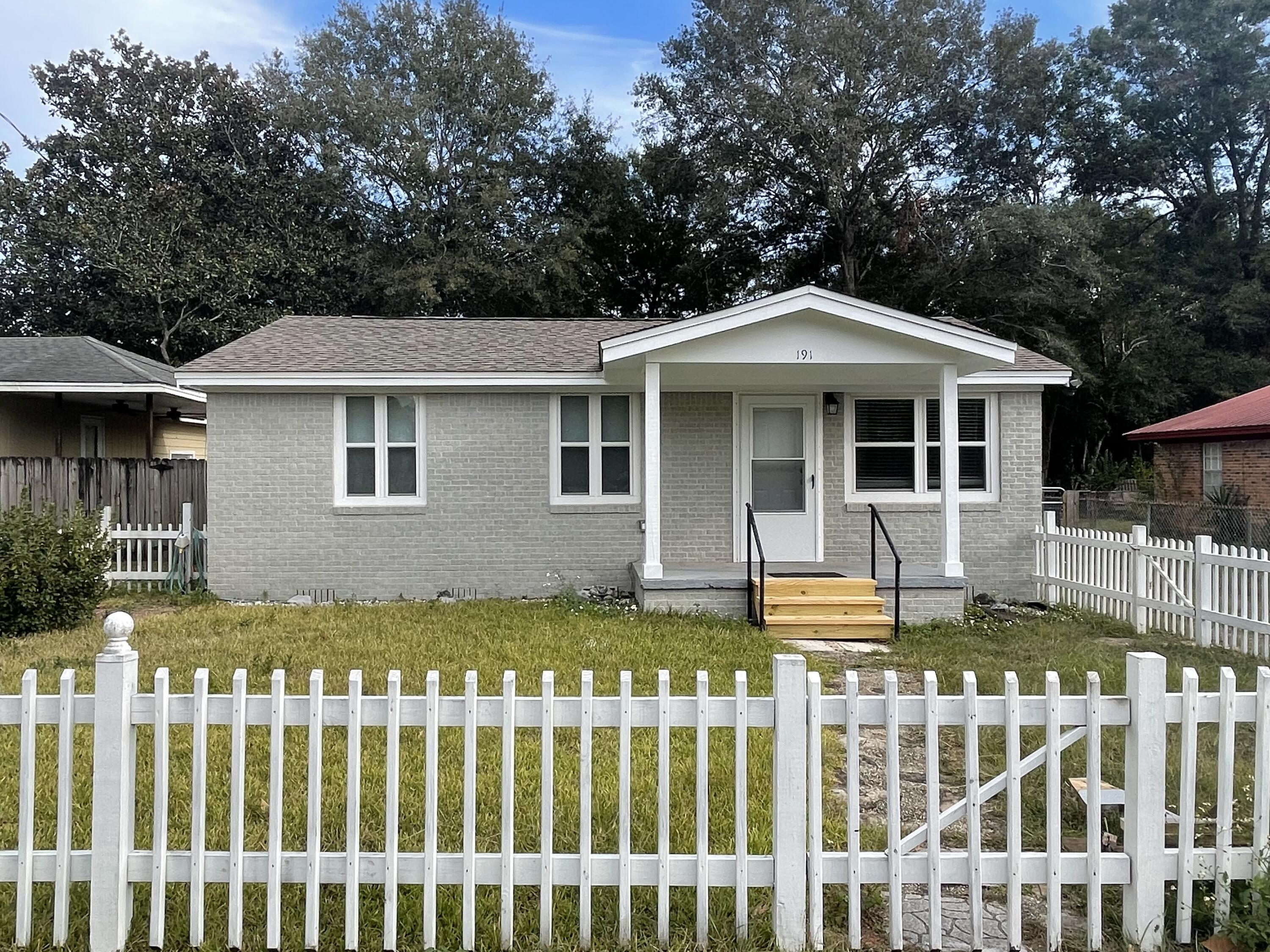 Available for move in immediately. Adorable 2 bedroom / 2 bath home centrally located near shopping & schools. Completely remodeled with hard surface flooring throughout, no carpet! Washer & dryer for tenant use. Screened porch & fenced in back yard.
