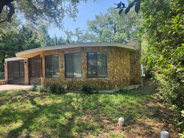 AVAILABLE NOW! Adorable Florida cottage just minutes from Eglin AFB. Stone exterior with an open floorplan. Large living area with large picture windows pipe in the natural light. Tile floors, breakfast bar, large bathroom with stand up tile shower and separate bath with a jacuzzi tub. Nice lot with mature native landscaping and a large workshop in the back! Don't miss it! NO PETS, NO VAPING, NO SMOKING. FIREPLACE IS NOT OPERATIONAL, FOR LOOKS ONLY. Applicants to verify items of importance including room sizes and school zones. .
