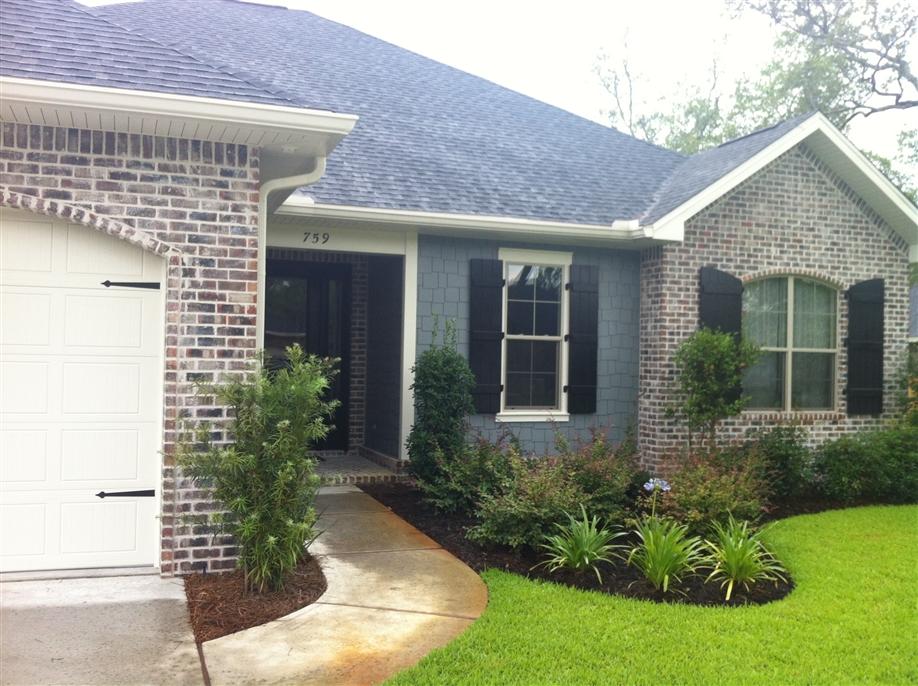 4 bedroom,2.5 bath brick house in new ''Magnolia Woods'' subdivision. 10' ceilings, 8'doors, granite counter tops, stainless appliances, copper farmhouse sink, screened in porch. House is prewired for alarm system and surround sound.