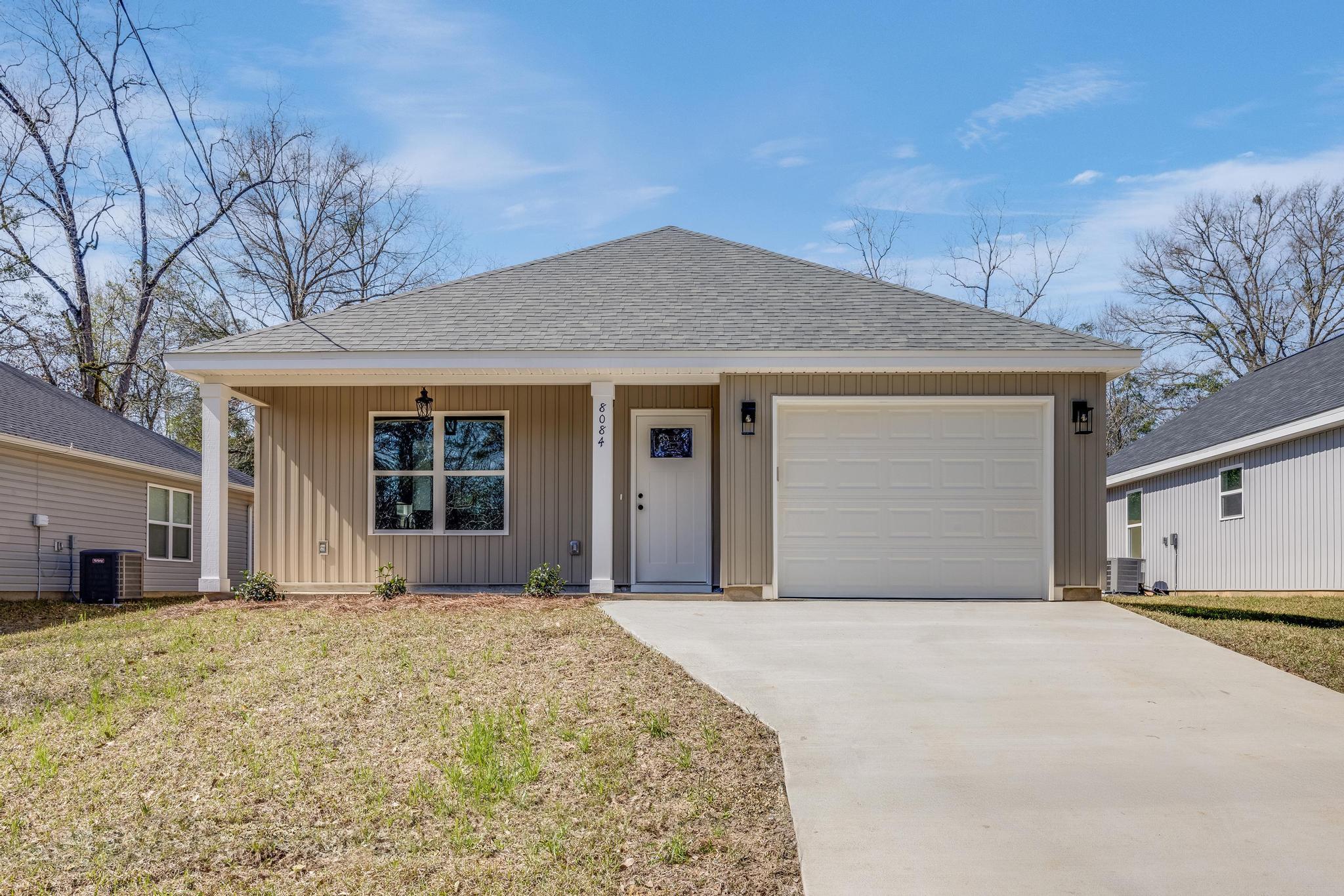 LOW MONTHLY PAYMENT--This home has it ALL!Builder is VA-approved and local, and is offering you a deal you can't pass up! Get ANYWAY CASH--use it however you want: a price reduction, closing costs, or a rate buy down--your choice!BONUS: Use our preferred lender and they will help buy down your interest rate!That's not all--this home comes LOADED with FREEBIES: Luxury vinyl plank flooring throughout (no carpet!) Granite countertops in the kitchen AND bathrooms. Premium fixtures. PRIVACY FENCED IN BACKYARD. Stainless steel refrigerator included. FREE Ring Doorbell Camera with purchase. FREE 1-year builder's home warranty. FREE survey. FREE landscaping package. ADDITIONALLY, benefit from low property taxes and affordable home insurance--around $700 annually, thanks to the prime location and new construction. And let's not forget the home is brand-new 3 bed, 2 bath just steps from Laurel Hill School, featuring stylish finishes, a stunning kitchen with custom white cabinets, and a master suite with a double vanity and walk-in closet. Enjoy a flat, sodded yard and a covered patio for relaxing evenings.This is more than a home it's a deal packed with value. Don't miss your chance!
