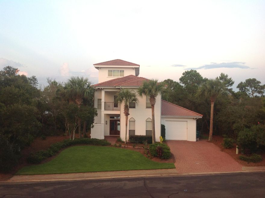Luxury awaits you in this beautifully appointed lake front home just a short stroll to the beach. Gated community, with pool, work out room, hot tub, tennis and updated clubhouse. Solid wood custom front door, windows with hurricane resistant glass, wood flooring on ground floor opening into the elegant living area with a wall of windows over looking the lake. Granite stone wall with magnetic storage, enhances the entertainment center wall. Kitchen has stainless appliances, granite counter tops, with a butlers pantry and wet bar with one wine refrigerator and beer refrigerator. First floor bedroom with tiled bathroom accents, the oversized master has a custom oversized window to capture the serene views, and a his and hers closet and en suite with wrap around balcony. The en suite has a