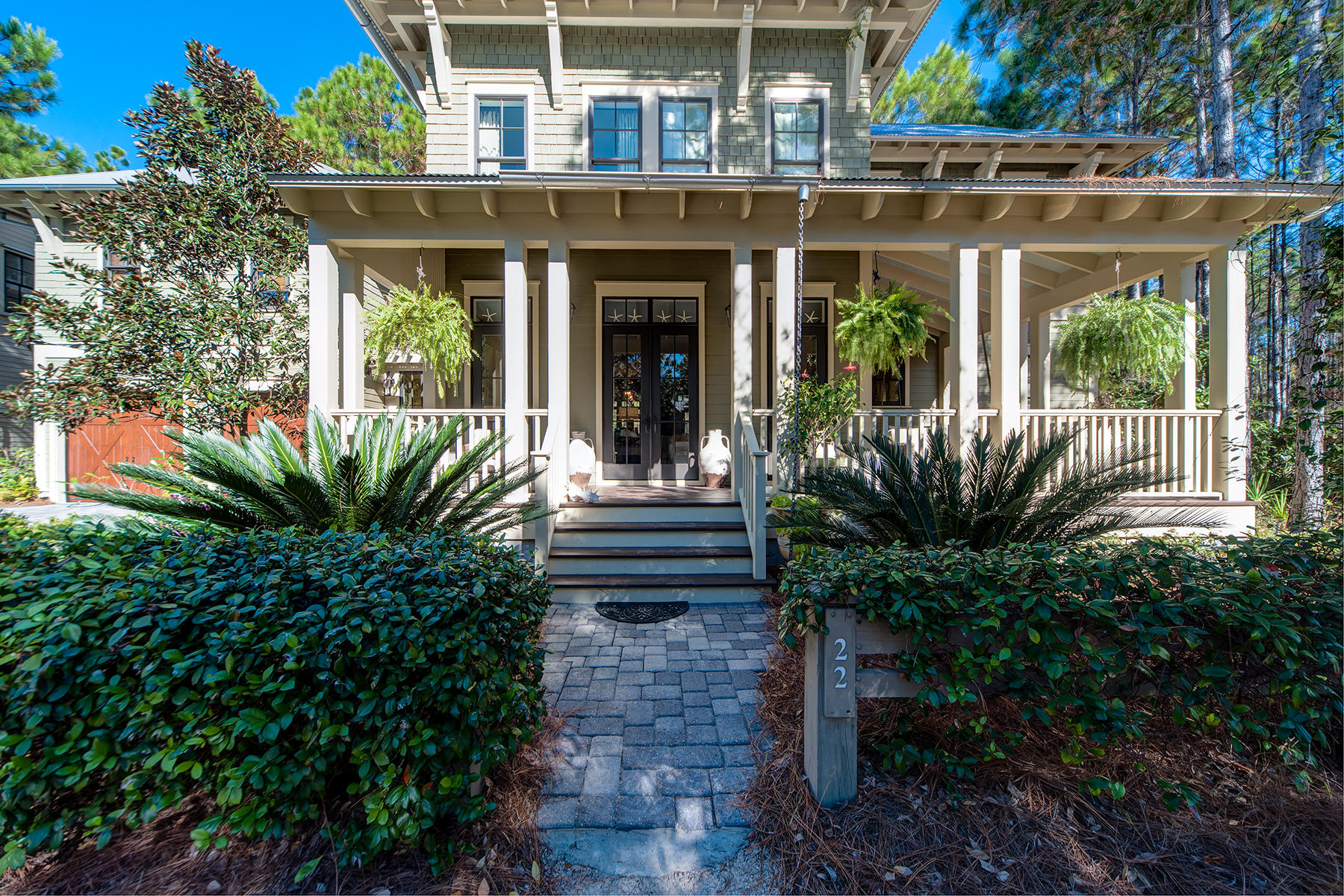 Stunning custom built Watercolor home comes to market for the first time! Situated on one of the largest homesites in the entire community of Watercolor, this 5 bedroom home including it's carriage house has been immaculately cared for and has never been rented. Creatively designed by TS Adams Studio and artfully built by Chris Clark Construction, who used only the finest materials and finishes to build this one of kind Watercolor home. Reclaimed heart of pine hardwood floors carry throughout. A fantastic open floor plan was designed using plenty of windows offering an abundance of natural light. Wolf and Sub Zero appliances, a generous kitchen island, and a breakfast nook make up this beautiful designer kitchen, which effortlessly connects to the living and dining areas. Also found on the first floor is a dedicated powder room, and one of the two master bedrooms that joins the cozy screened back porch, overlooking the serene wooded and protected areas to the rear of the home. The second master suite is located on the second level, along with two additional guest bedrooms each with it's own bathrooms, and a wrap-around screened porch, for year round enjoyment. The spacious carriage house, situated above the two car garage has a separate living room, kitchen, private bedroom, and bathroom. Situated on this uniquely extra large 150 ft wide wooded backyard, you will find a fire pit and plenty of outdoor space to enjoy. The home is move in ready and is being sold mostly furnished with short list of seller exclusions.