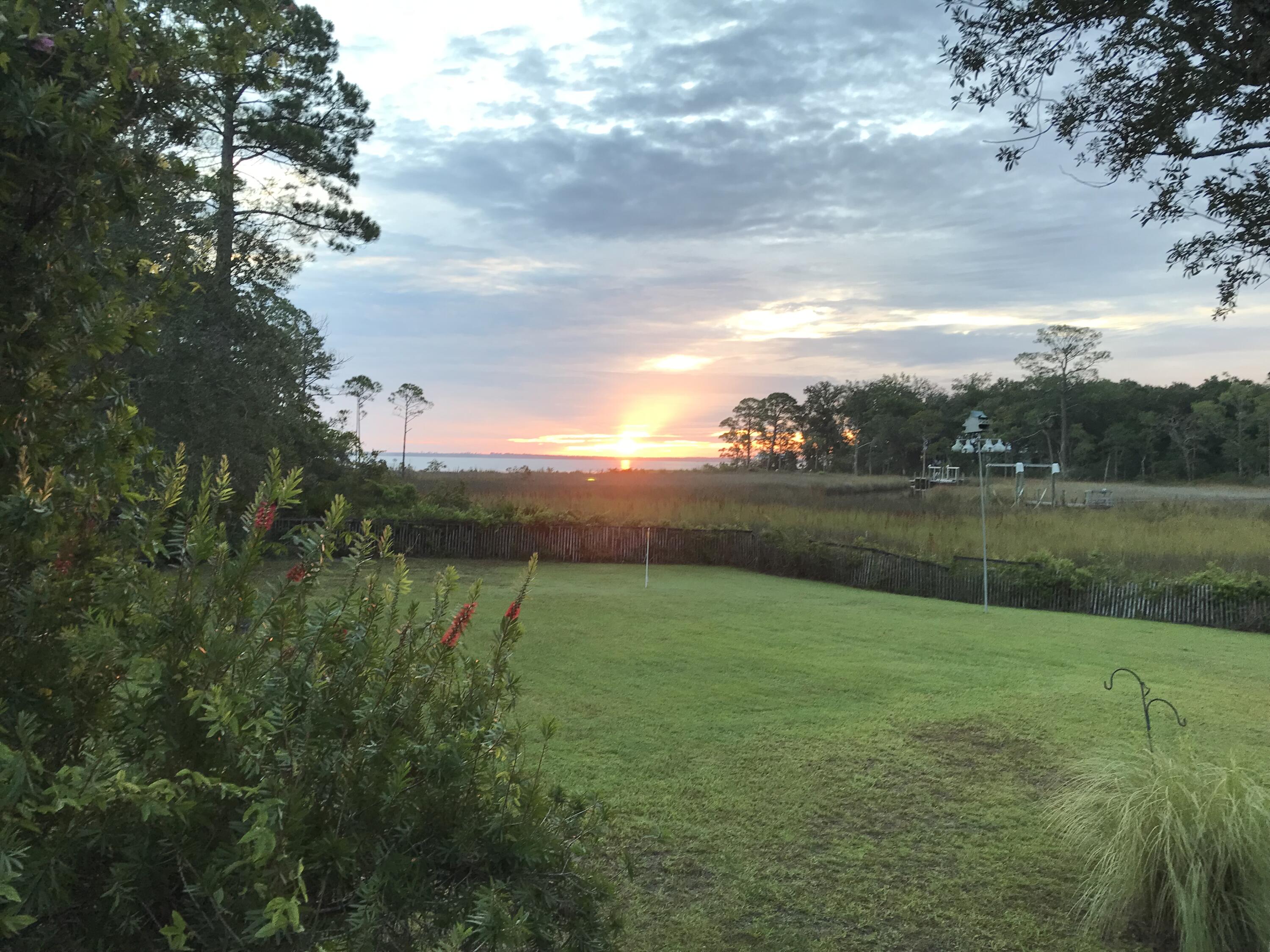 This is a very private waterfront home located on a private road with splendid views of the bayou and the bay. It is surrounded by nature, and water and absolutely no neighbors on close to 1 Acre Unbelievable sunrises. Nestled in a gorgeous garden with lots of fruit trees. This is the total Zen House, yet so close to everything. A 3-bay carport can accommodate most of your toys and there's plenty of space on the property including a locked storage shed for your tools. Owner is relocating and is offering this gem that has brought the family so much peace and quiet for the last few years. Available October 15th 2022.By appointment only. Home is occupied. Absolutely NO DROP INS please. The home is on a private road and contact with agent must be made prior to secure a showing of the premises