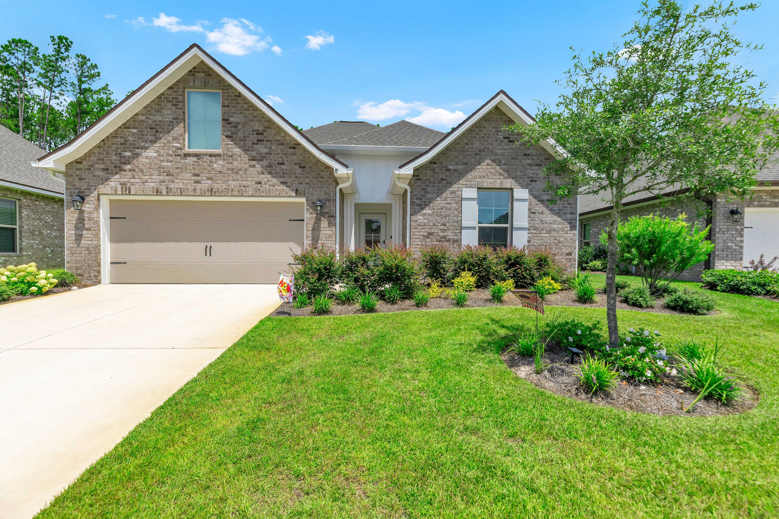 Built in 2023 and just 19 miles to the world class 30A beaches, this beautifully upgraded home in ''Bliss at Hammock Bay'' backs to a peaceful and private nature preserve! This beautifully upgraded turn-key home includes: quartz countertops thoughout, undercabinet lighting, wood-look tile in every room (no carpet), undermount sinks, framed mirrors, and a built-in computer niche. The open concept layout features a bright kitchen, split floor plan, vaulted ceiling and ample natural light. All closets and spacious pantry have quality wood shelving! Exterior highlights include gutters, an extended patio, fenced backyard, front storm door, rear screen door, and flood lights. Hammock Bay offer an exceptional lifestyle with three clubhouses, resort-style pools, an 8,000 SF fitness center, lit pickleball courts, dog parks, 60 acre sports complex and scenic wallking trails. There is even an Events Coordinator, General Store, Brewery and food trucks! You will love the daily beach walks/sunsets and exploring all the hotspots in Grayton, Seaside, Alys and Rosemary Beach as well! Come see your new pristine home at 18 Cozy Cove! Buyer to verify all information and dimensions important to them.