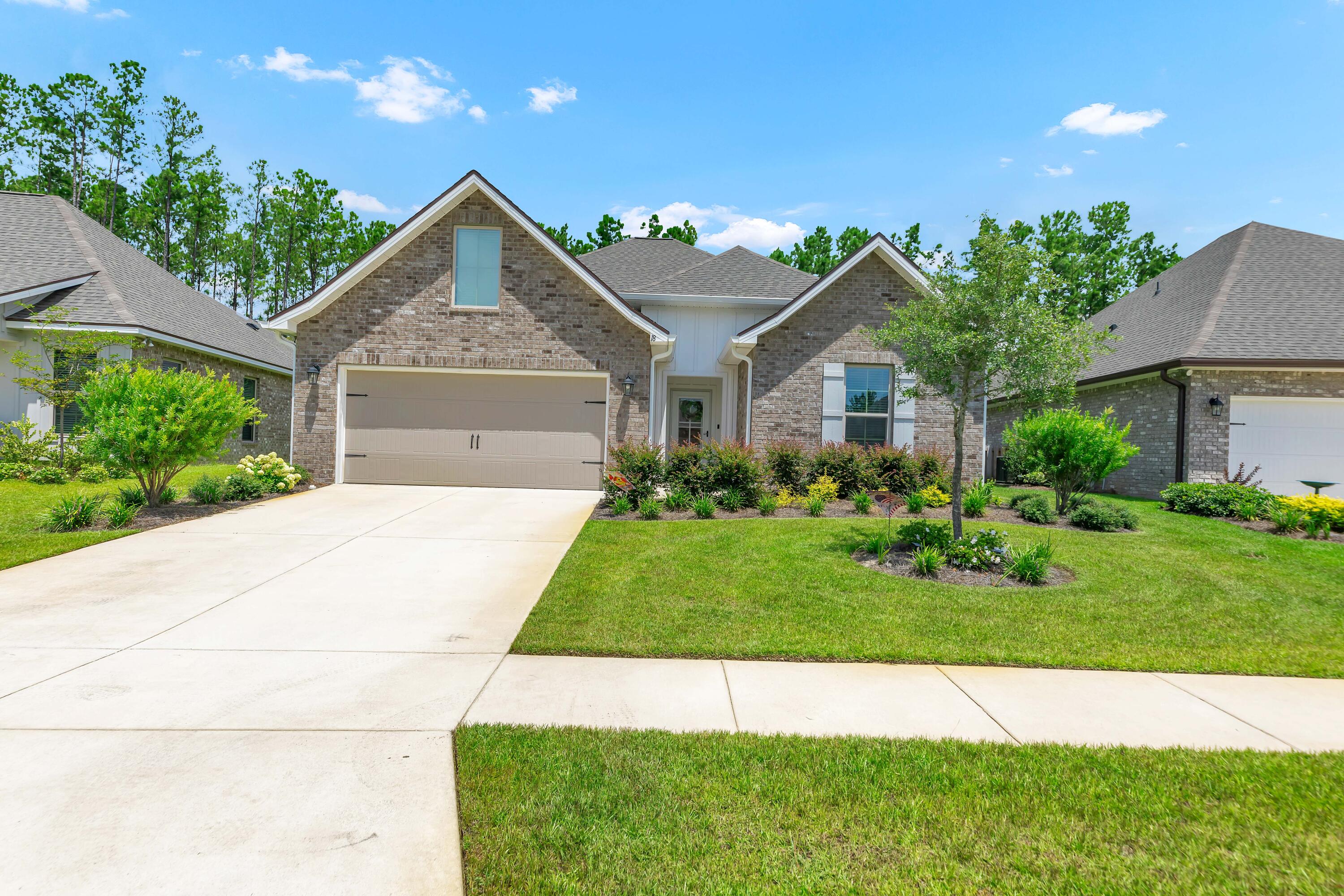 Built in 2023 and just 19 miles to the world class 30A beaches, this beautifully upgraded home in ''Bliss at Hammock Bay'' backs to a peaceful and private nature preserve! This beautifully upgraded turn-key home includes: quartz countertops thoughout, undercabinet lighting, wood-look tile in every room (no carpet), undermount sinks, framed mirrors, and a built-in computer niche. The open concept layout features a bright kitchen, split floor plan, vaulted ceiling and ample natural light. All closets and spacious pantry have quality wood shelving! Exterior highlights include gutters, an extended patio, fenced backyard, front storm door, rear screen door, and flood lights. Hammock Bay offer an exceptional lifestyle with three clubhouses, resort-style pools, an 8,000 SF fitness center, lit pickleball courts, dog parks, 60 acre sports complex and scenic wallking trails. There is even an Events Coordinator, General Store, Brewery and food trucks! You will love the daily beach walks/sunsets and exploring all the hotspots in Grayton, Seaside, Alys and Rosemary Beach as well! Come see your new pristine home at 18 Cozy Cove! Buyer to verify all information and dimensions important to them.