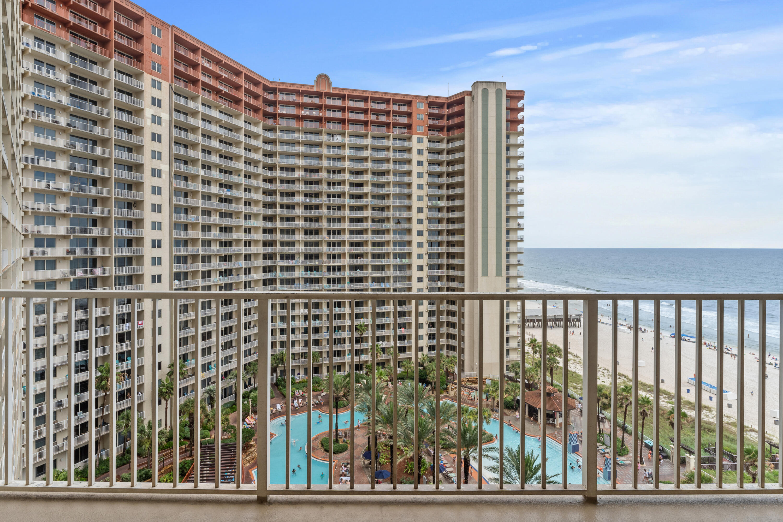 Step into one of Panama City Beach's most iconic resorts - Shores of Panama - and enjoy the rare convenience of a deeded parking space just outside the unit, on the same floor. Skip the elevator waits for exploring and head straight to your door, a luxury most units don't offer.This SE Gulf-facing unit offers stunning views from the living area and private balcony, perfect for relaxing after a day in the sun. The open layout features granite countertops, tile flooring throughout, and a bunk room with its own door and full bathroom, giving you the privacy and flexibility of a true two-bedroom setup.Enjoy resort-style amenities including the largest lagoon pool in PCB, indoor pool, spa, sauna, fitness center, and direct beach access. Located steps from dining, Walmart,