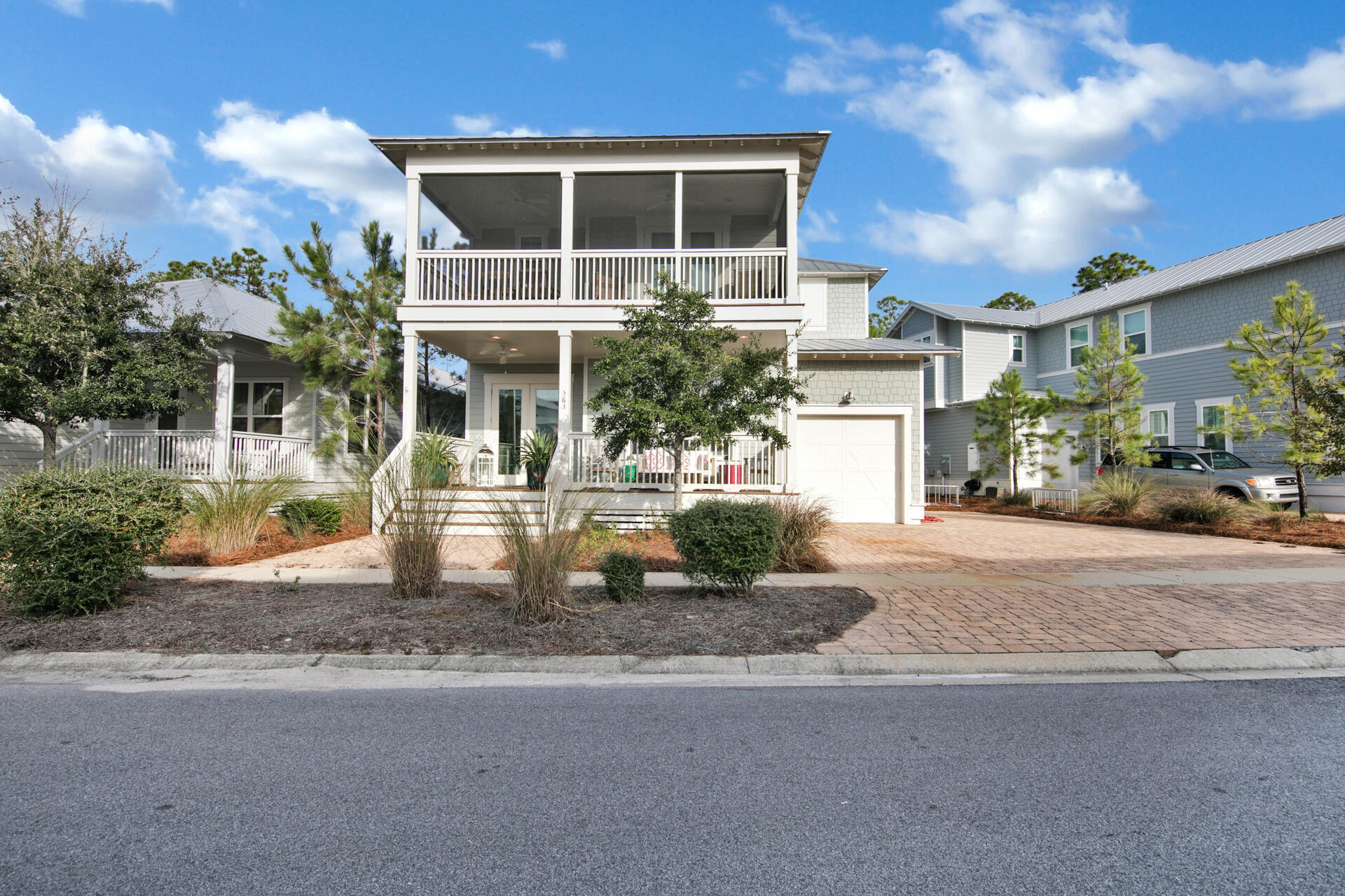 **This home is currently under contract, but is accepting back up offers.   This beautiful 4 bed, 4 1/2 bath home is being sold fully furnished and has never been rented.  There are two master suites with one on the main floor making this home perfect for a primary residence or a rental property.  This is not the typical builder spec- with unique and custom touches throughout such as carrara marble countertops and shaker cabinets that go to the ceiling and designer light fixtures. There is ample driveway parking and a golf cart garage. Screened porches off the front and back offer great space for outdoor living and entertaining.  All of this with master bedrooms on both floors Golf cart is negotiable.